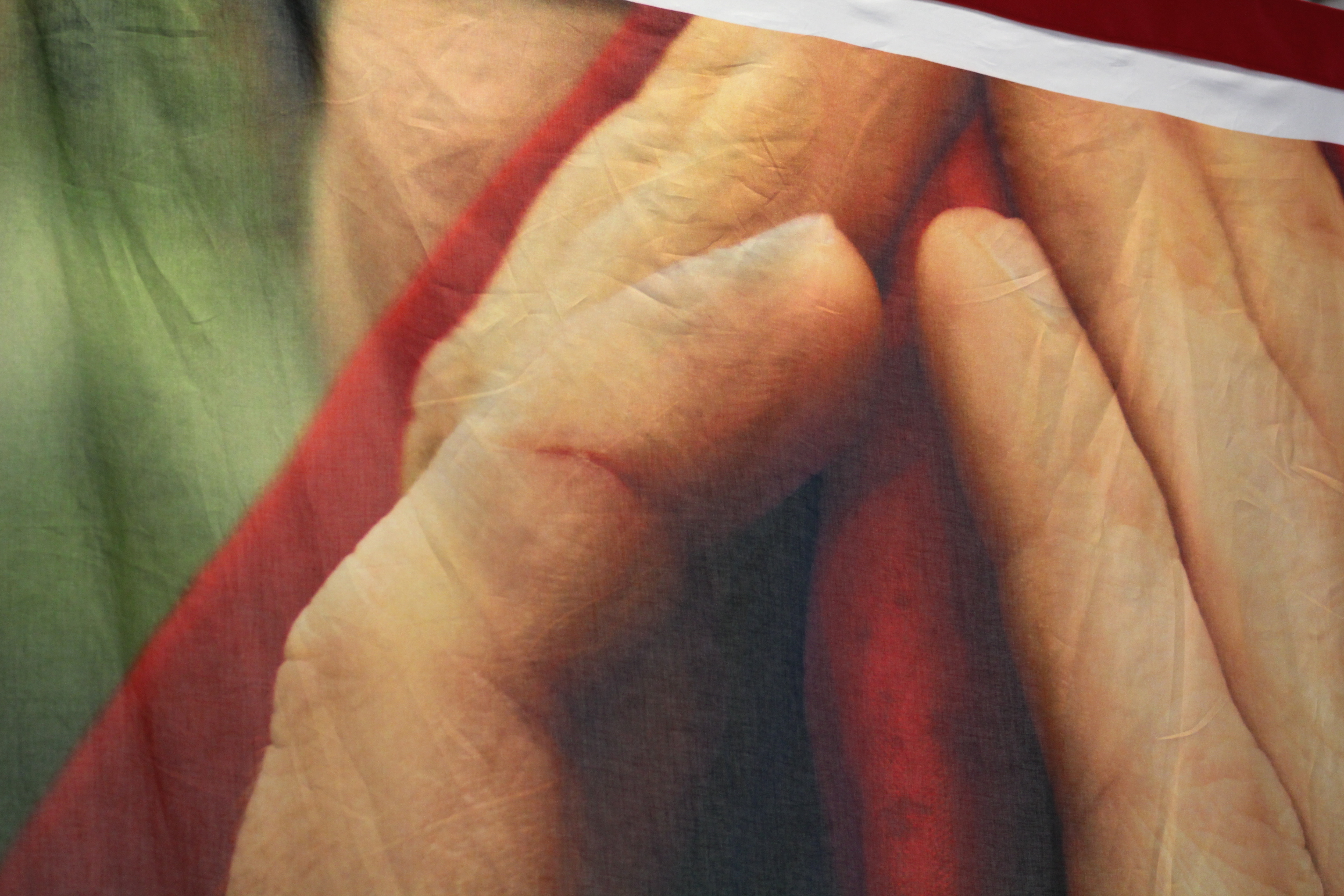 Visible spit and condensation speckle the vermillion, Shinto red