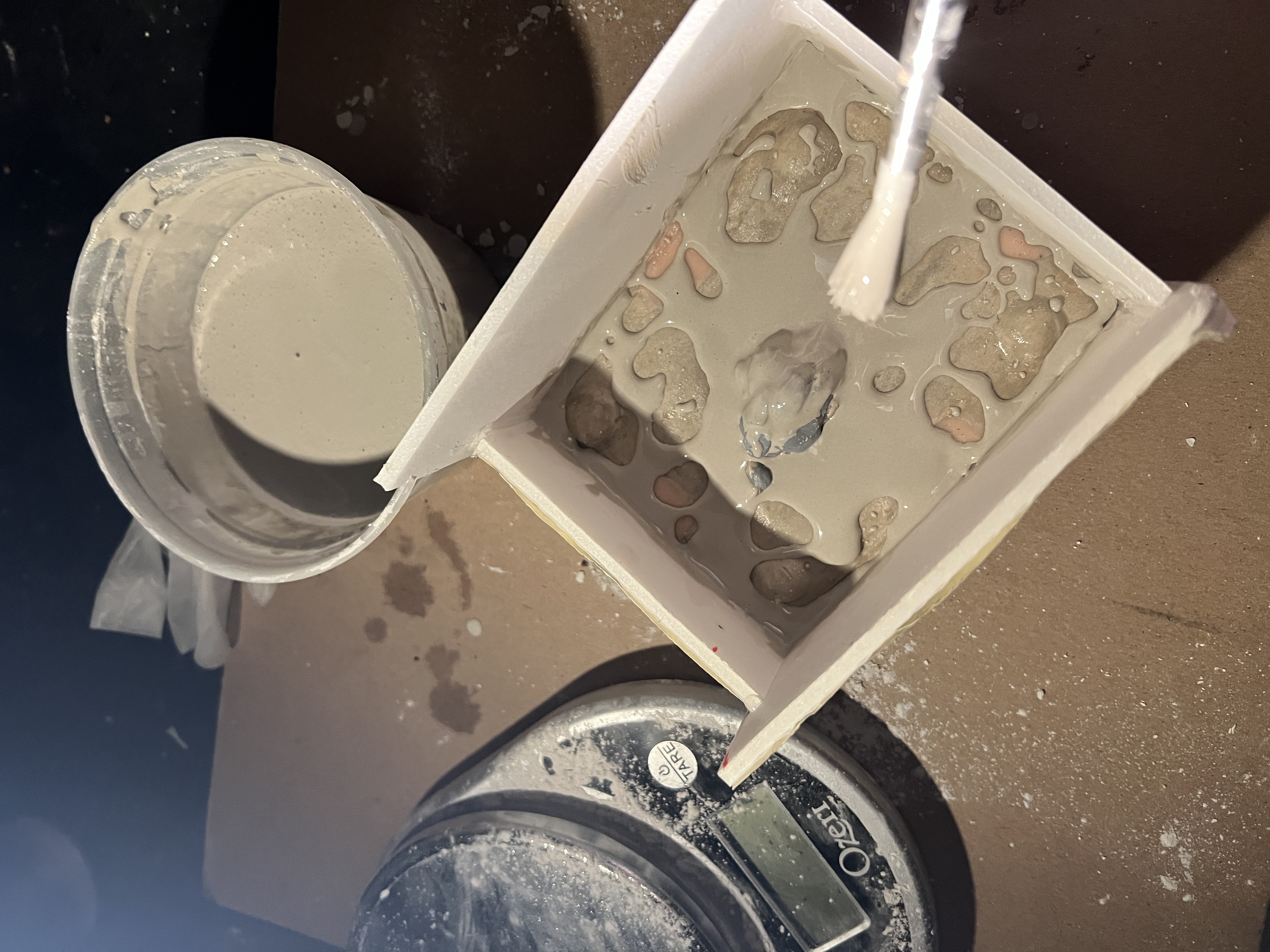 First layer of plaster on sculpted figure and clay.