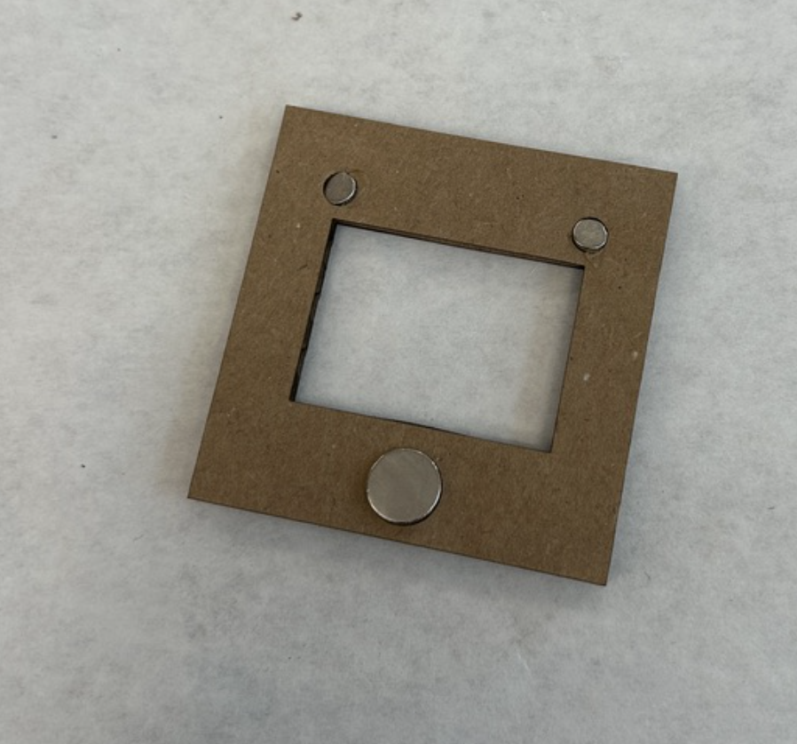 I lasercut the frame and engraved holes for the 3 magnets