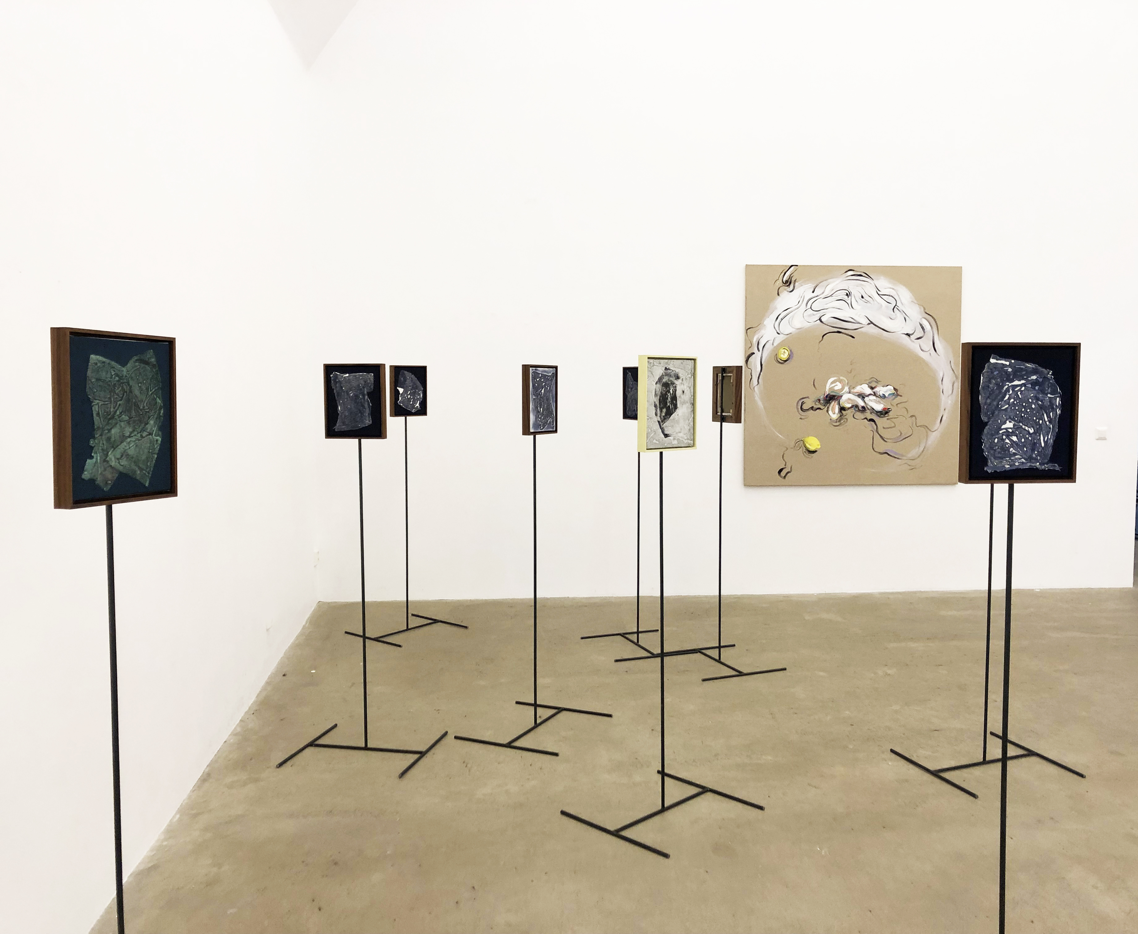 Sigrid Sandström: small paintings on steel stands, Jenny Kalliokulju: painting on the wall 2019