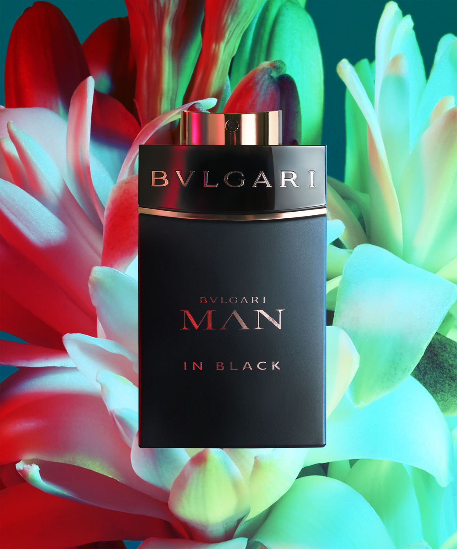 KMA photographer Daniel Schweizer photographs a photo of a black perfume bottle for Bulgari with flowers in the background