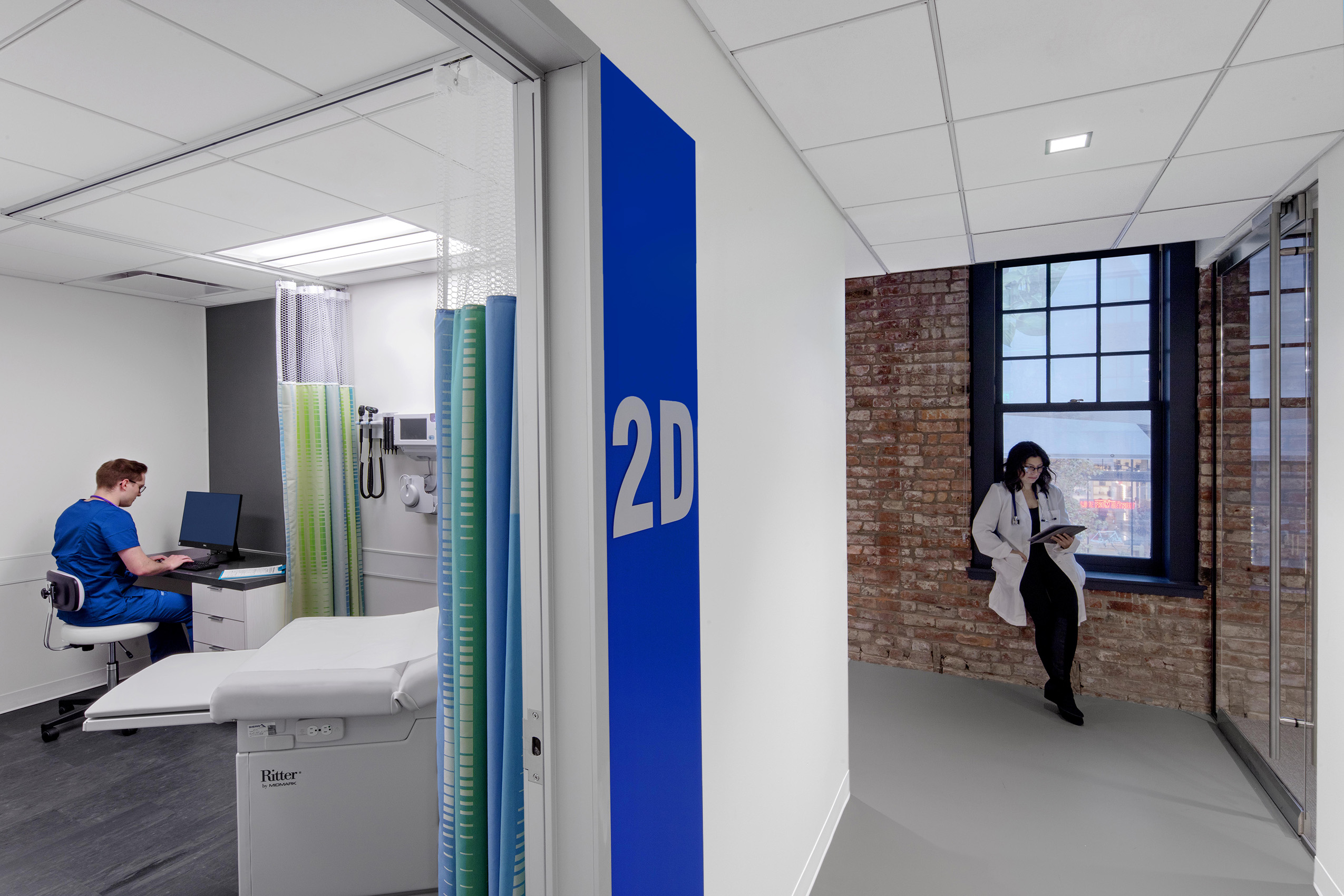 The facility includes a retail pharmacy, physical therapy suite, travel medicine clinic, and research lab