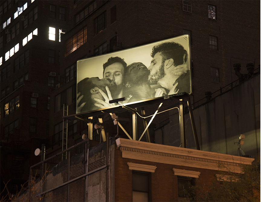 Self-portrait with Brendan Mahoney, Carlos Martiel and Jorge Sánchez from AMIGXS, No. 1, 2017. Billboard, 264 x 120 inches, installation view at night in Midtown Manhattan. 