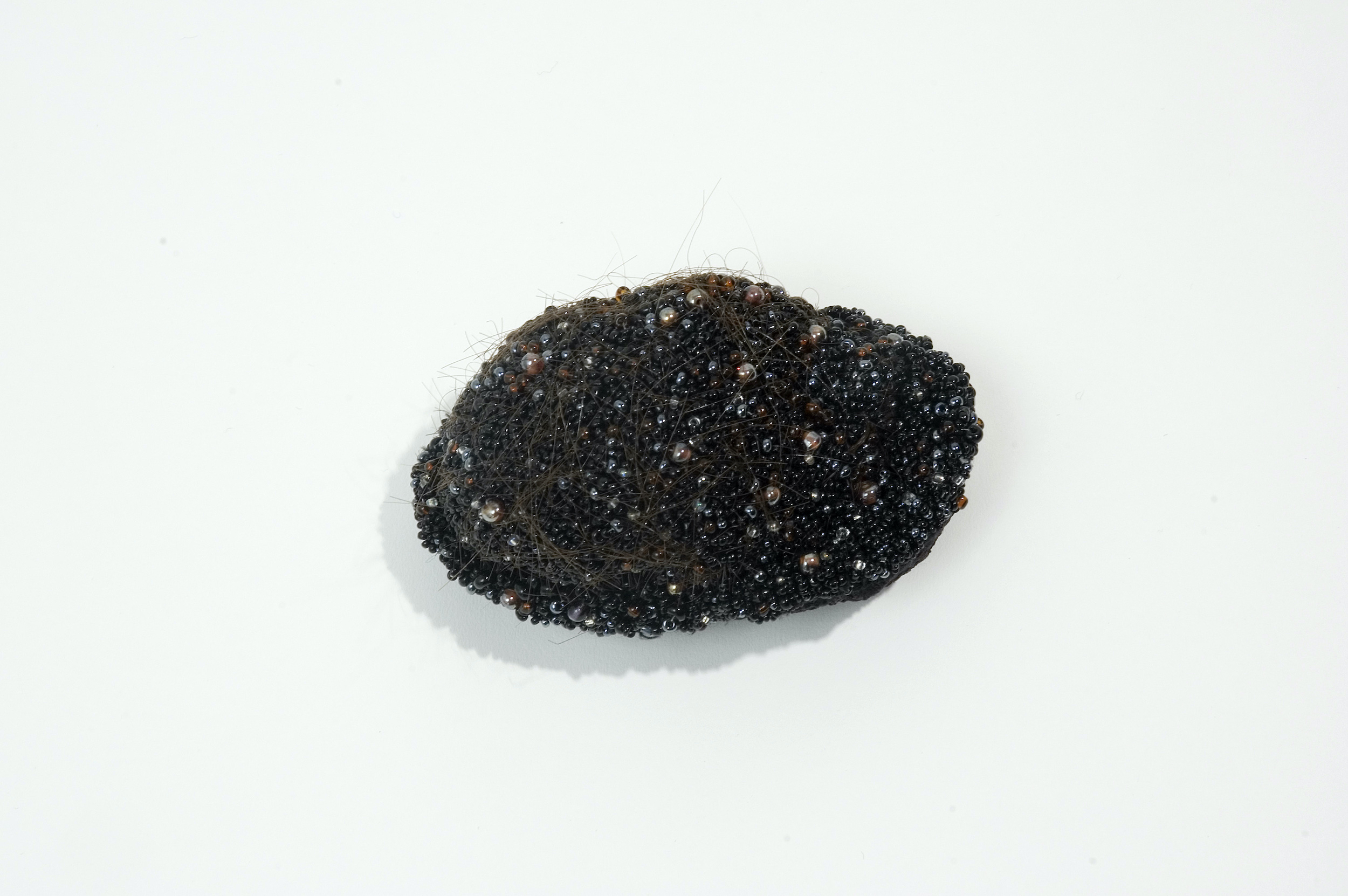  Negros, 2004 . Hand made felt, hair, fragments of silk and cotton embroidered with glass beads . 8 cm . Private Collection Amsterdam, The Netherlands 
