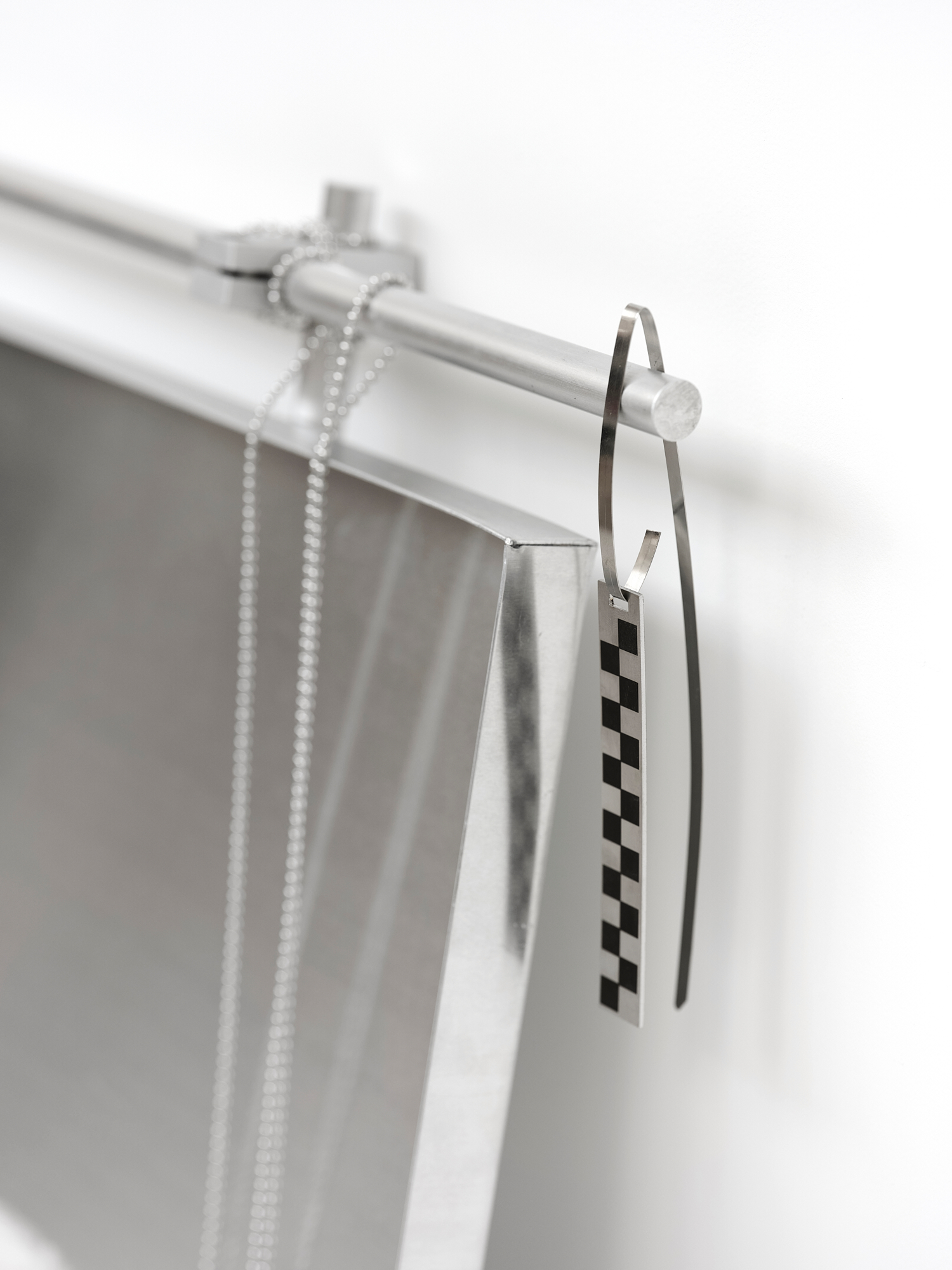 Imperma_38°00’04”N 100°54’43”E, 2024,  [60cm x 50cm x 20cm]  Eco resin, aluminium, pewter, labels, found metal components and drain chain 