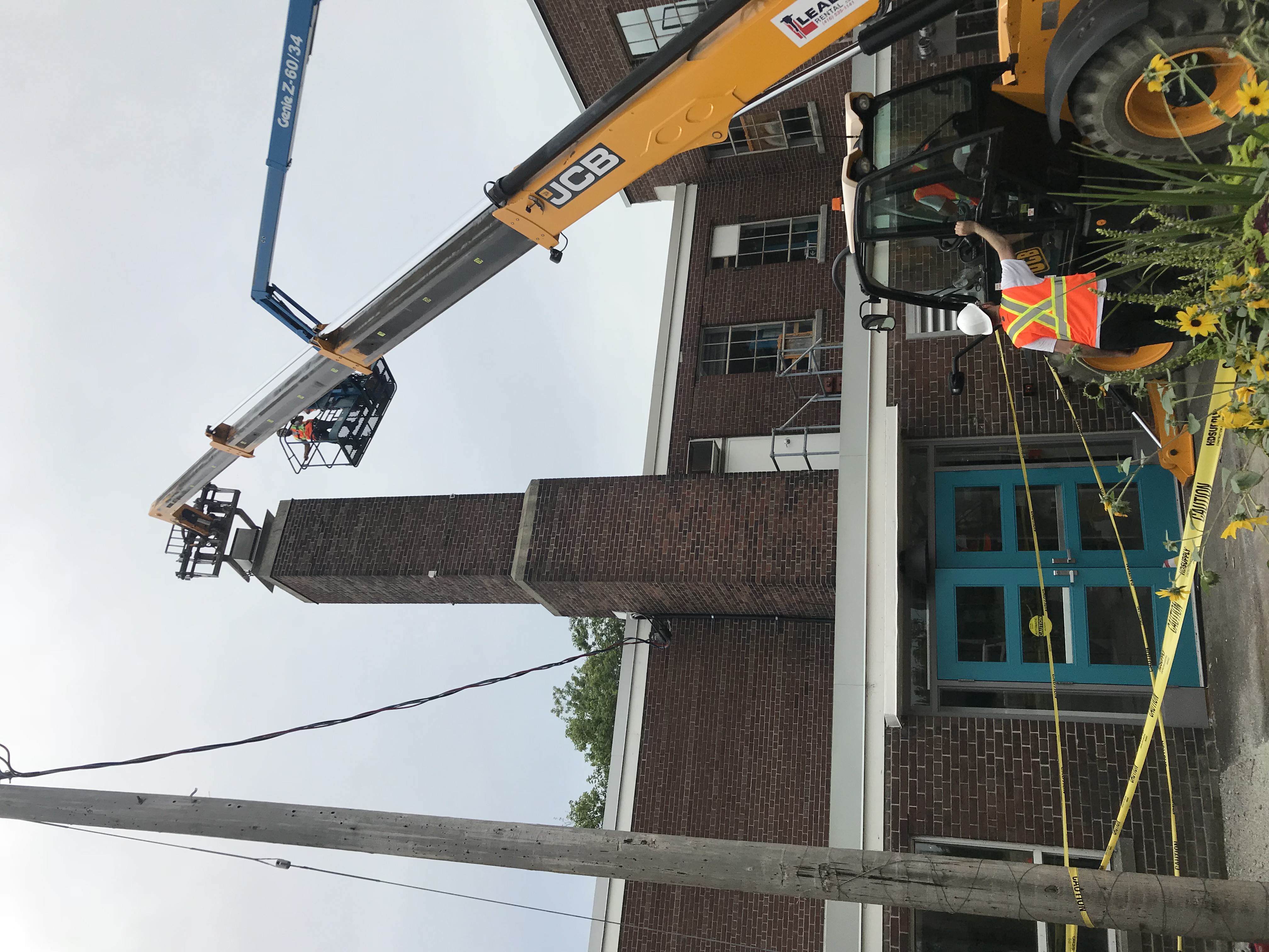 Installation in progress at the Small Arms Inspection building with two cranes