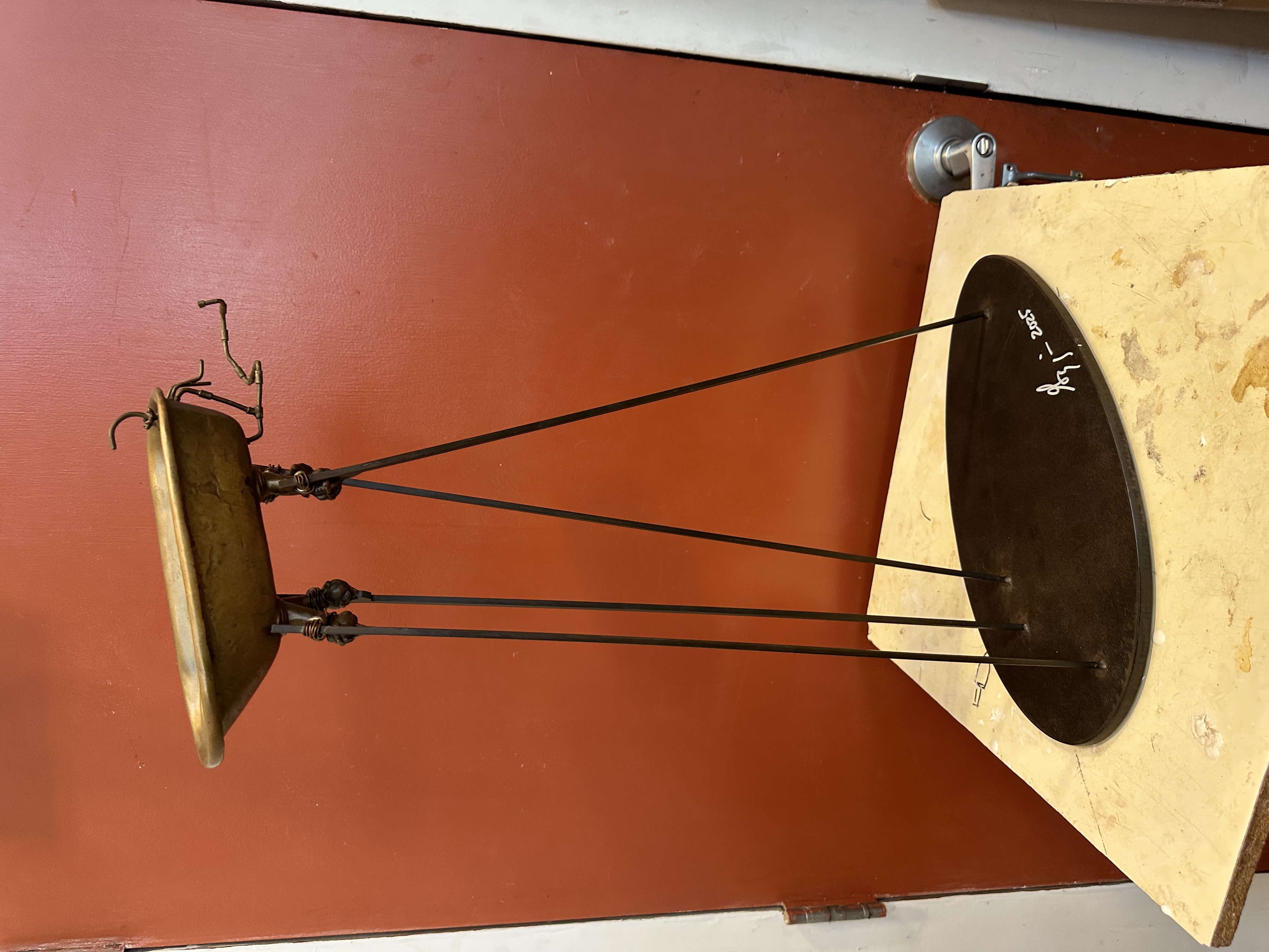 Bronze and steel sculpture titled 'Fine Balance' by Brian Goggin