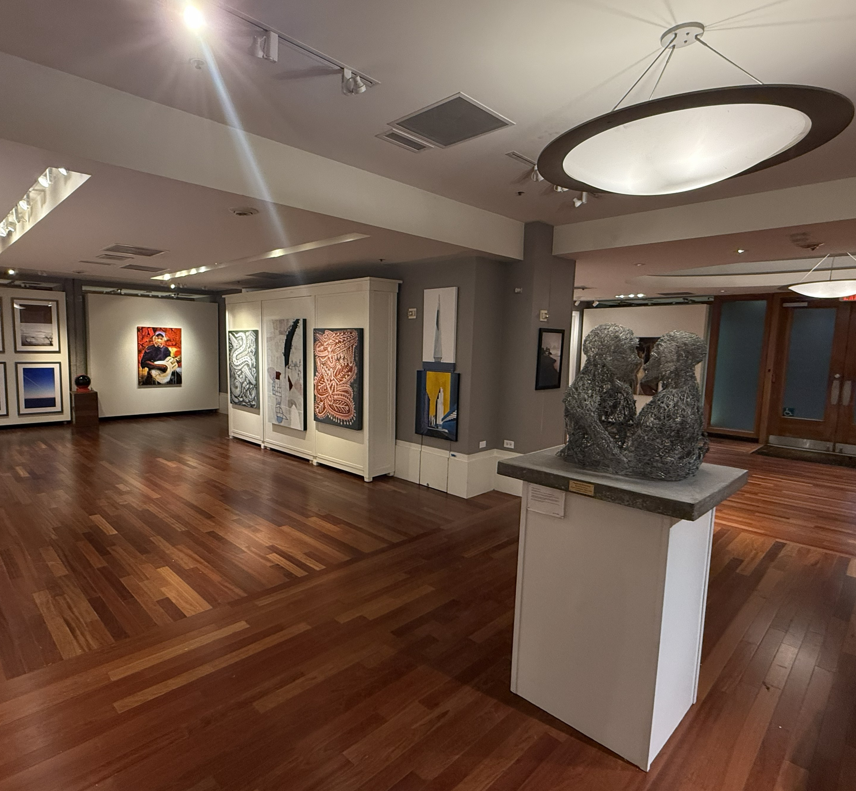 Detail view of the venue space interior showing seating and art.