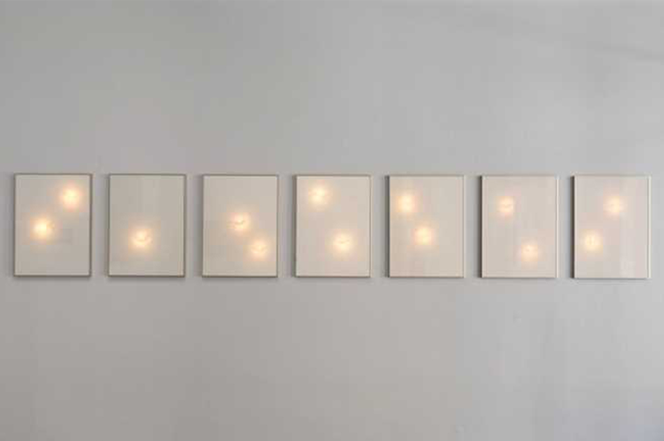 Carlos RiveraSin Estrellas, 20177 white canvases backlit and intervened with masking tape showing different bodies suspended in the void57 x 77 cm