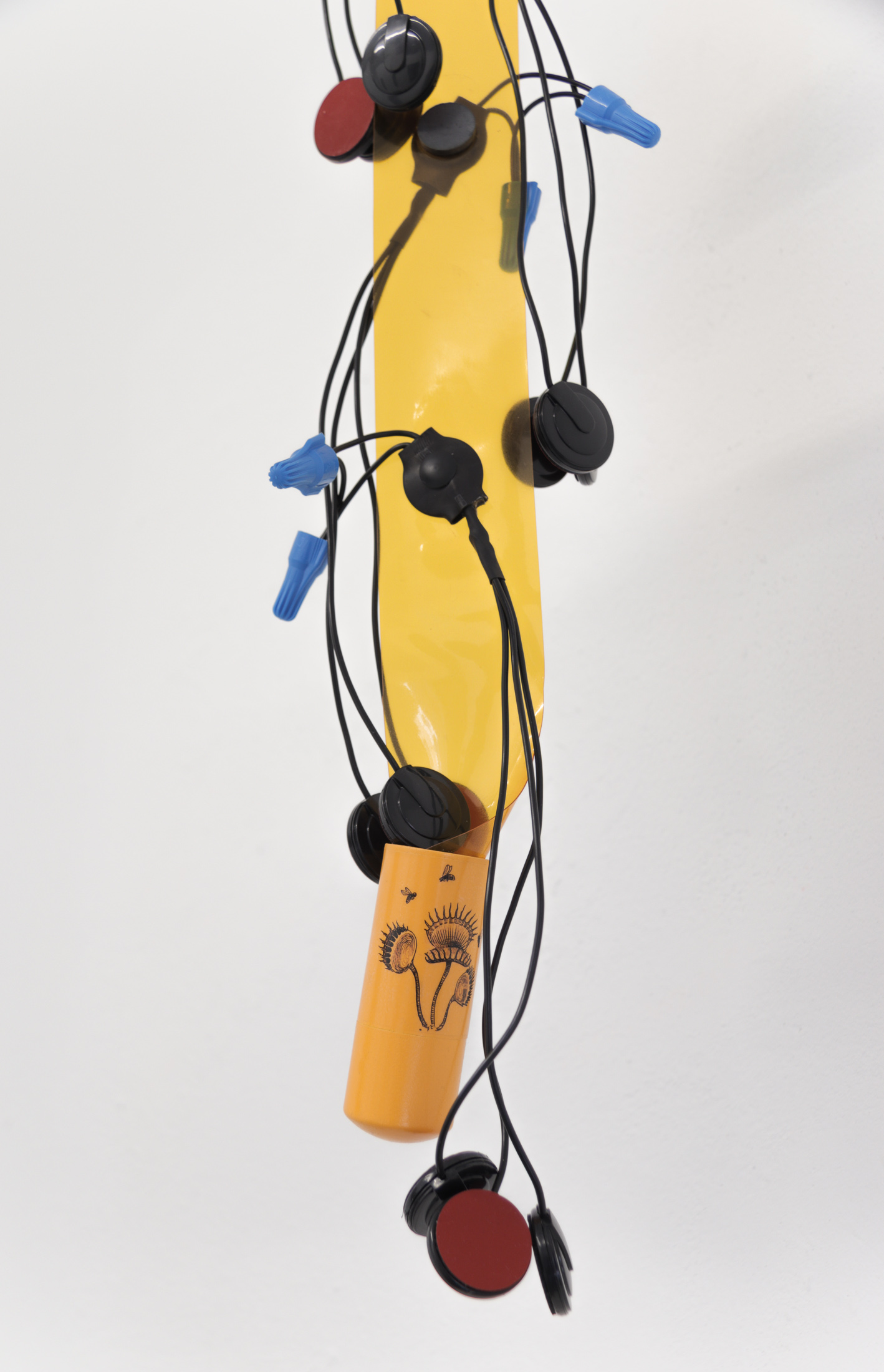 If the walls had ears (detail), 2023, electronic listening devices, welding curtain, pvc, magnets, decal, 33 x 6 x 4 in. (84 x 15 x 10 cm)