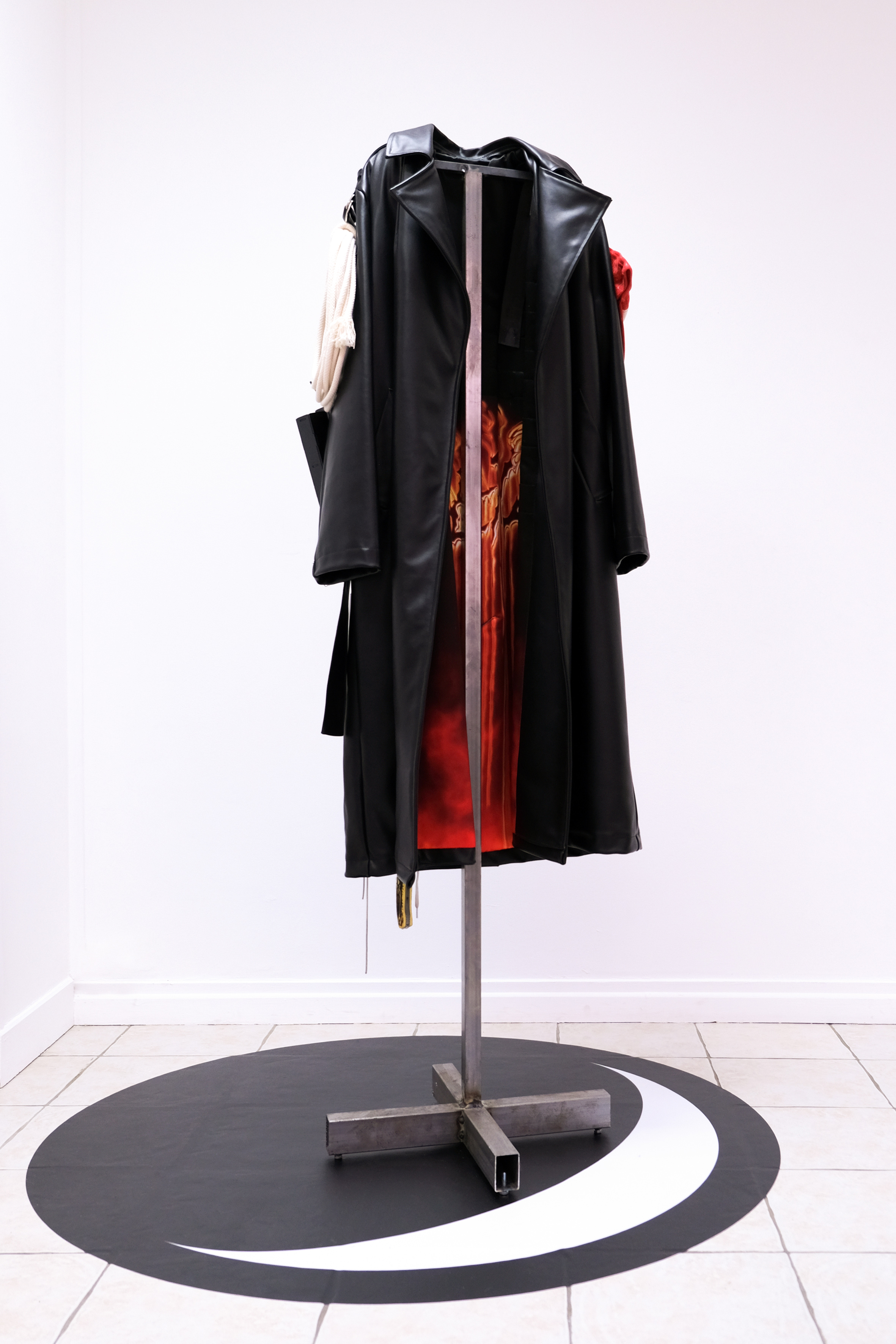 The End coat, 2021. Handmade coat, unique piece. Leather, satin, iron, various objects, variable sizes. YWNWA moon logo, 2021. Printed vinyl 130 cm x 119 cm.
