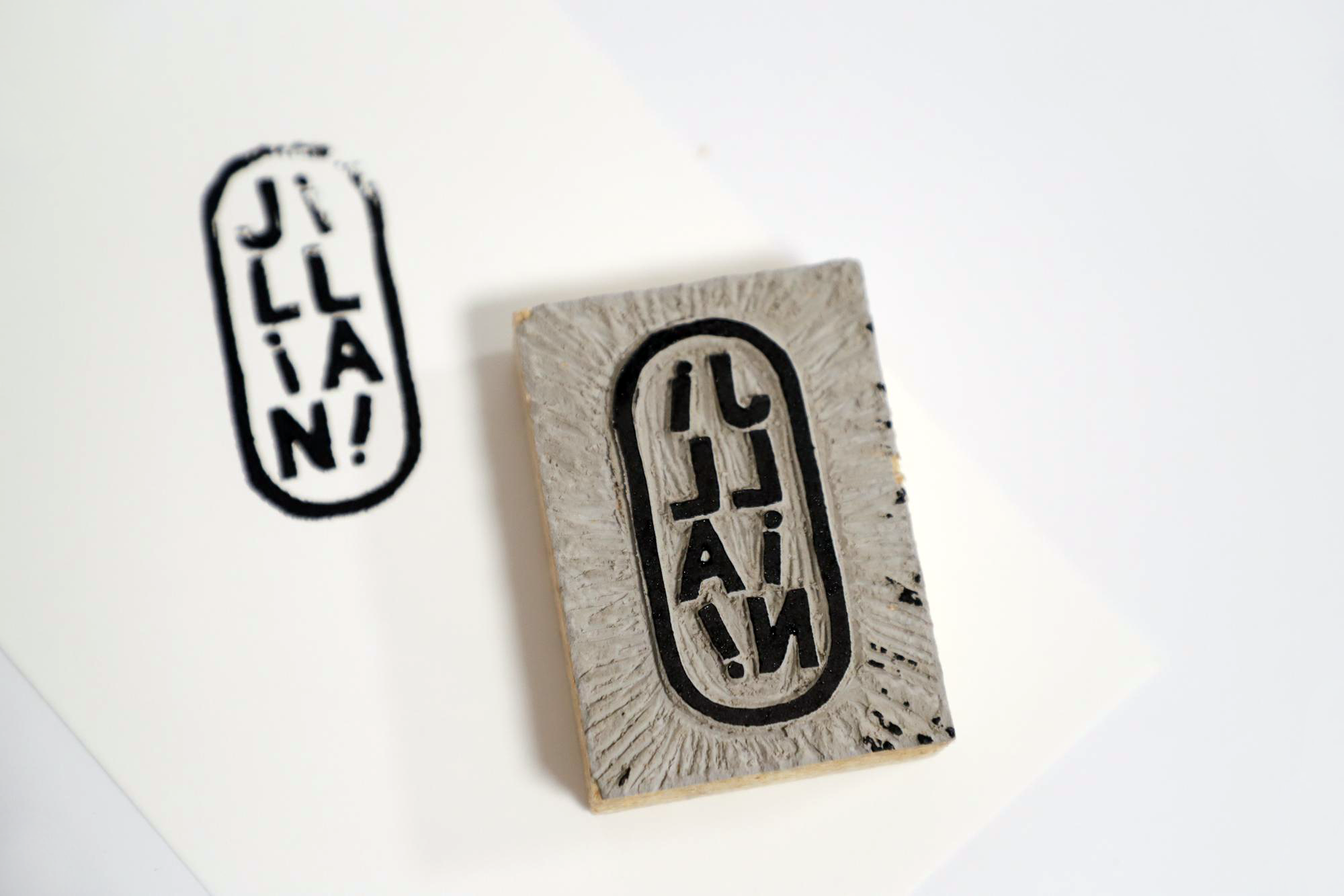 Print result of vertical oval "Jillian!" stamp with inked carving next to it.