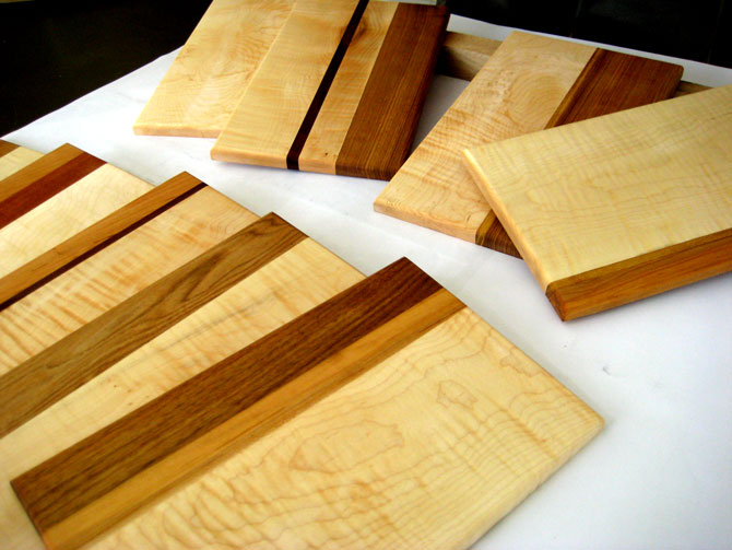 10 cheese boards for a chocolate shop in a variety of hardwoods