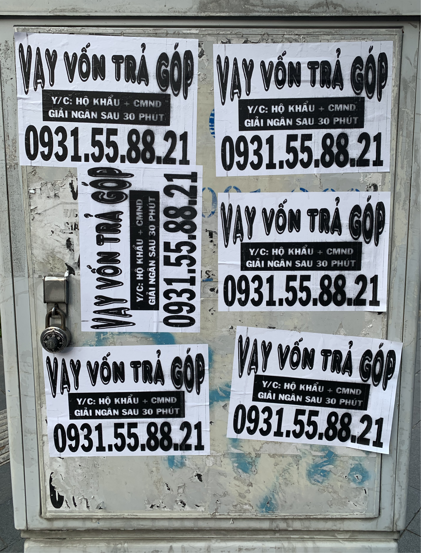 Vietnamese wild postings influenced concept of identity (instalment loans advertisment pictured).