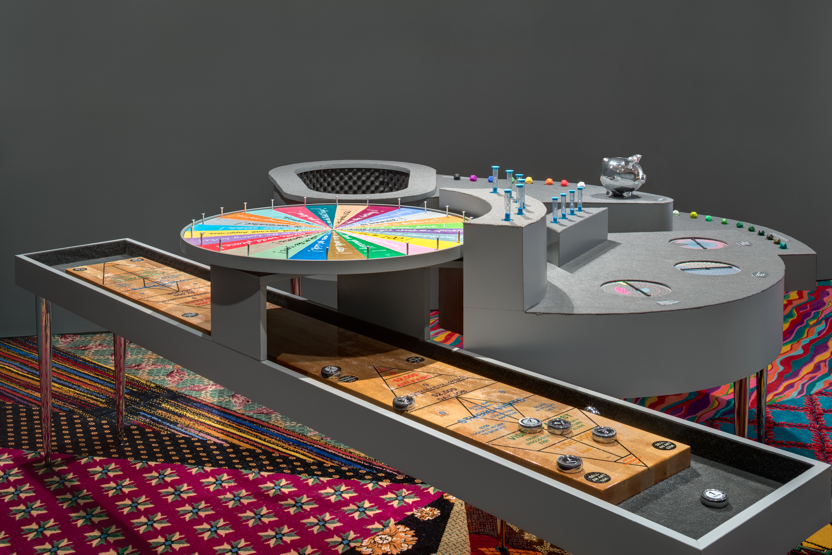 Installation shot, Statistics of Hope by Ghost of a Dream and Jennifer Dalton. Statistics of Chance, 2018. Mixed media, 40 x 125 x 160 inches. Where You Stand, 2018. Salvaged casino carpet, 21 x 36 feet. (Credit: Rafael Gamo)