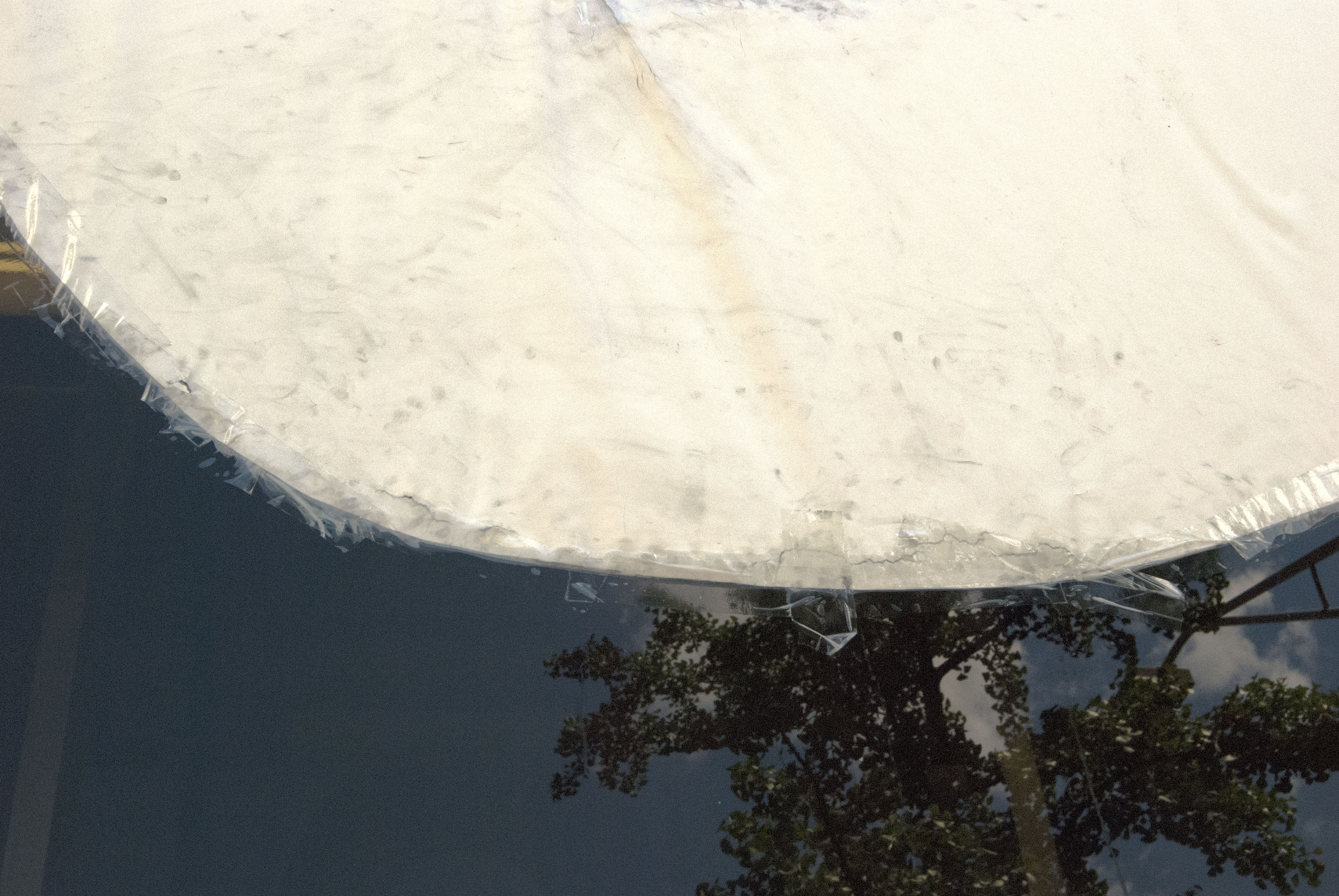 2/5 — PORTEND.  While in residency at MOTE90 in Columbus, OH, Quinn used a former banking institution's interior as a studio space and site for her installation project PORTEND.  This project was curated by Nayeon Yang.  With the building scheduled for future demolition, the installation's various elements included hand-cut paper, transparent packing tape, drapery, box fans, box fan boxes, copper pipe, 1,000 single-use plastic shopping bags, plastic jugs of water (one open), 2015.