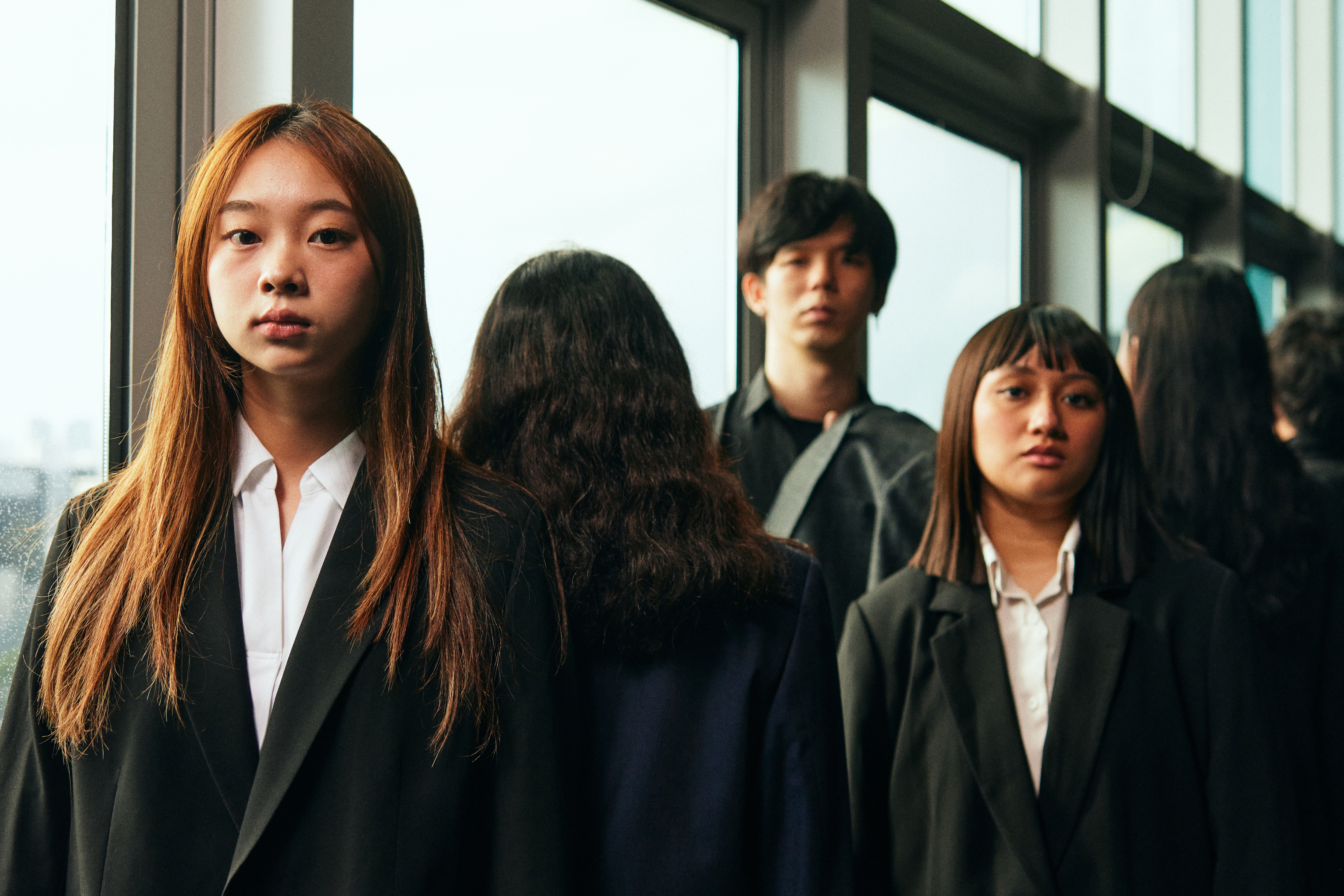 Image 4 of 7: A group of Asian youths