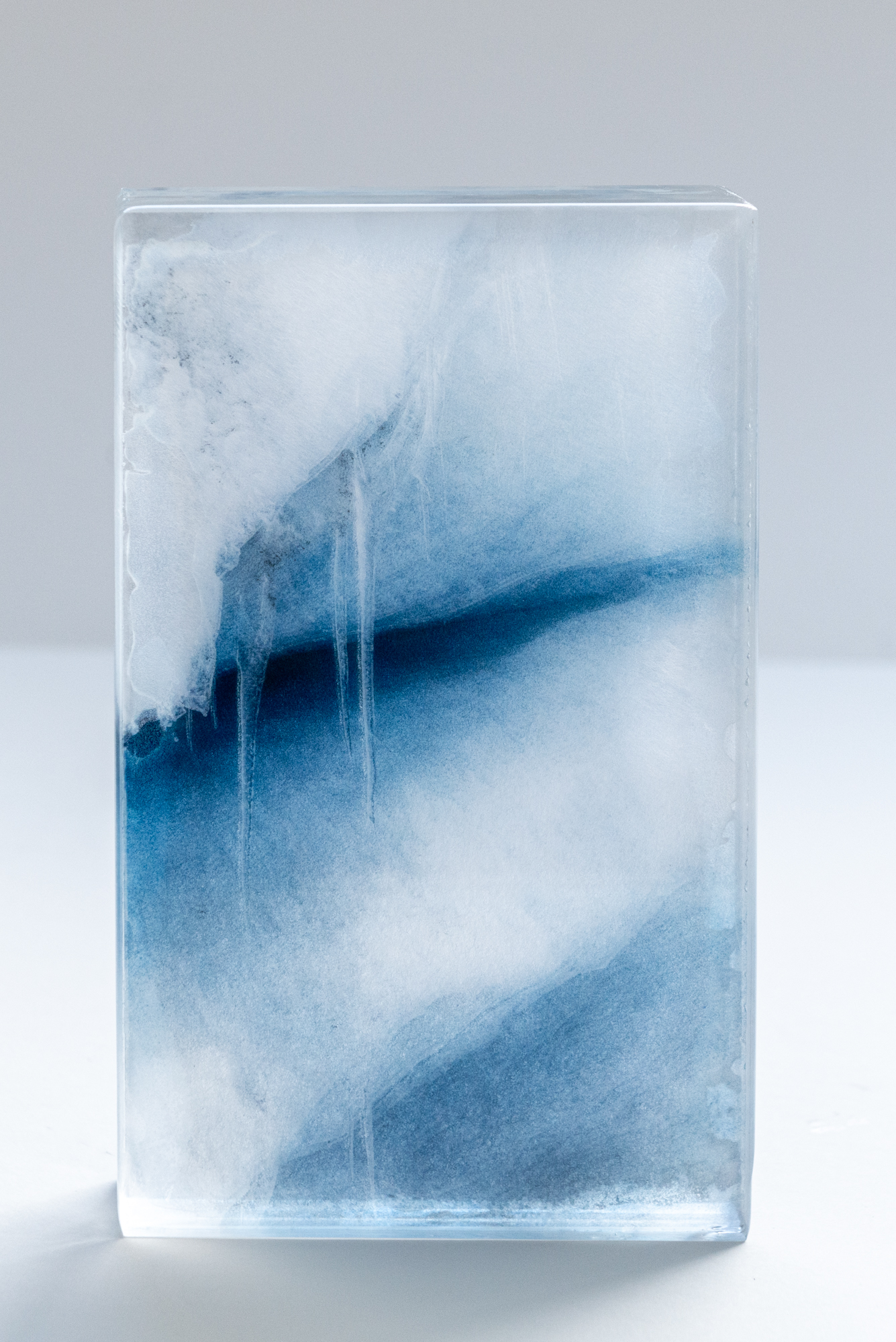 GLACIER #4 | 2024 | UNIQUE PIECE | Layered sculpture, consisting of printed transparents & 10gs washi paper, cast with resin | 21 X 15 X 5 CM