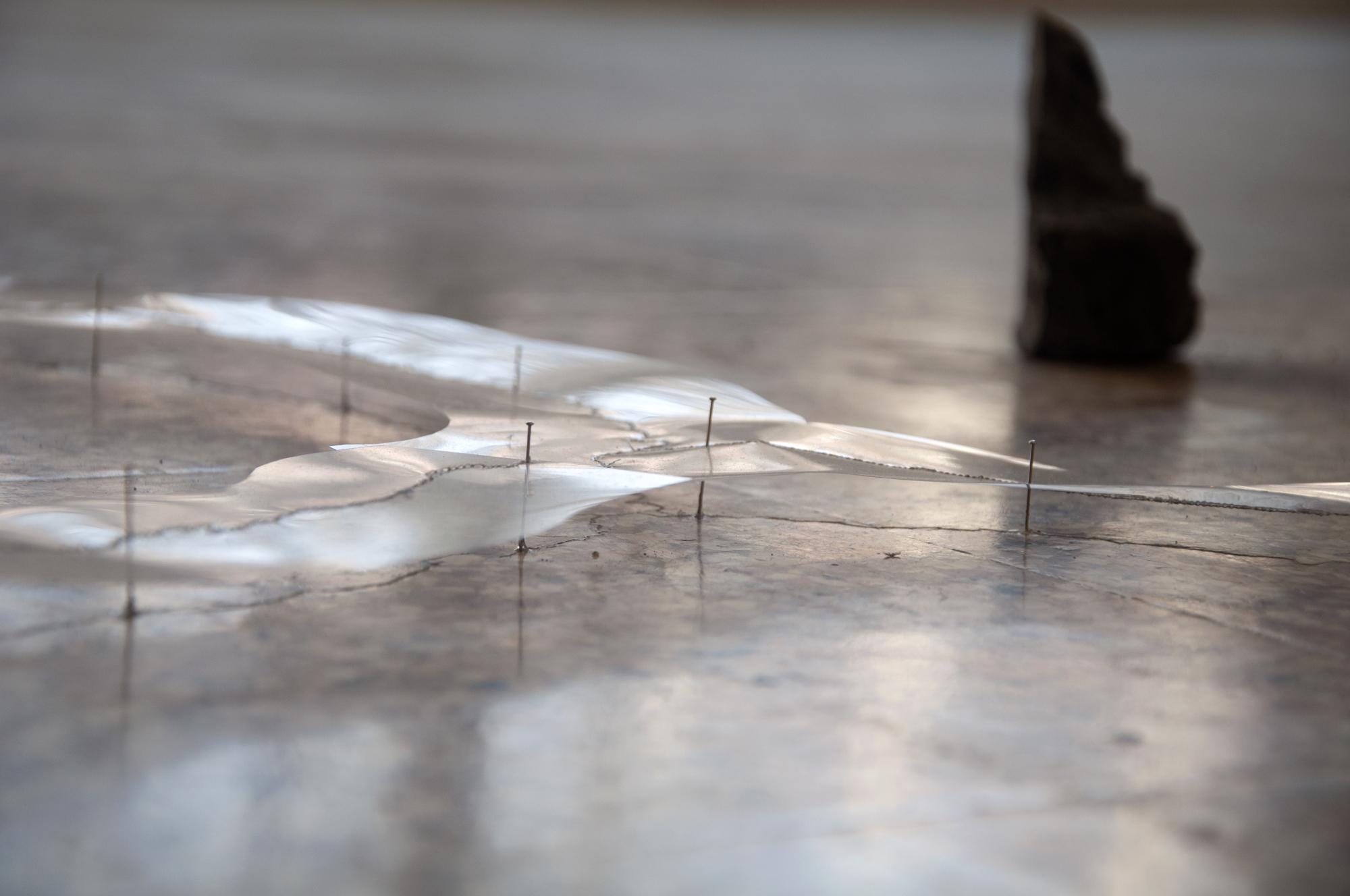 Rebecca Beachy – white cotton thread, carbon paper transfer, transparency film, sewing pins – ash cast from burned work, winter fires (Chicago 2012-present)