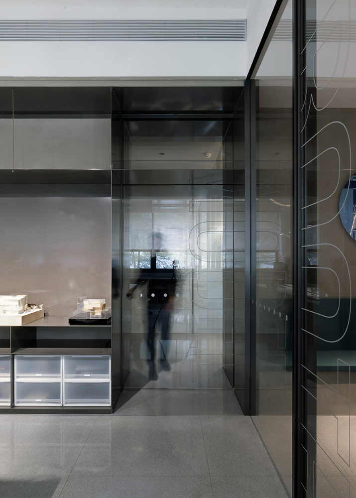 transparencies: glazed door separating the model room from the office space