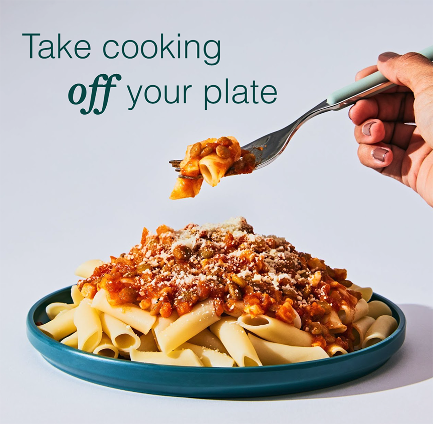 Studio shot of a fork lift from a perfectly plated dish of pasta; copy reads: Take cooking off your plate.