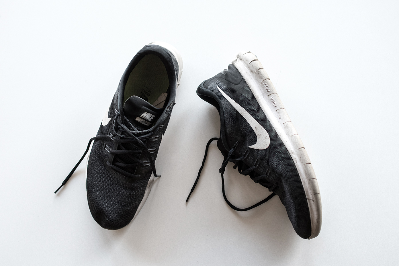 A beaten-up, but well loved pair of NIKE Free Runs