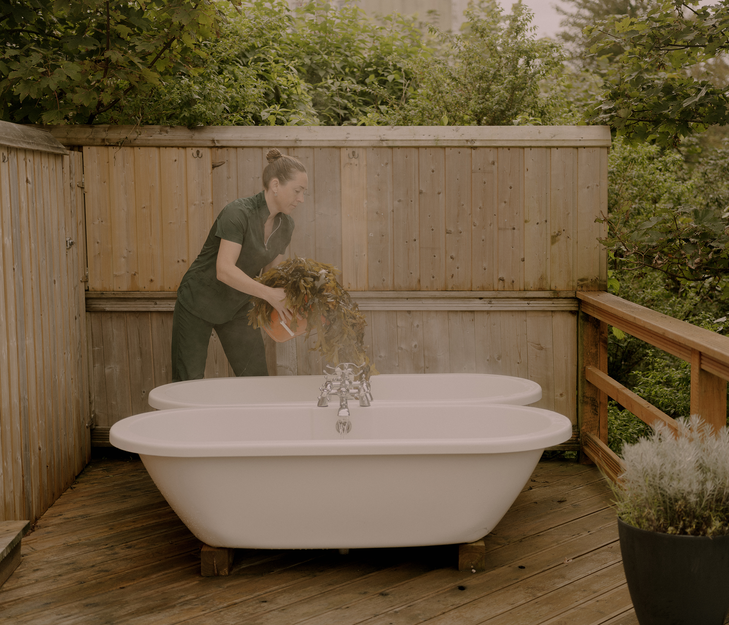 Niamh Ní Chuaig prepares an outdoors seaweed bath at Connemara Seaweed Baths