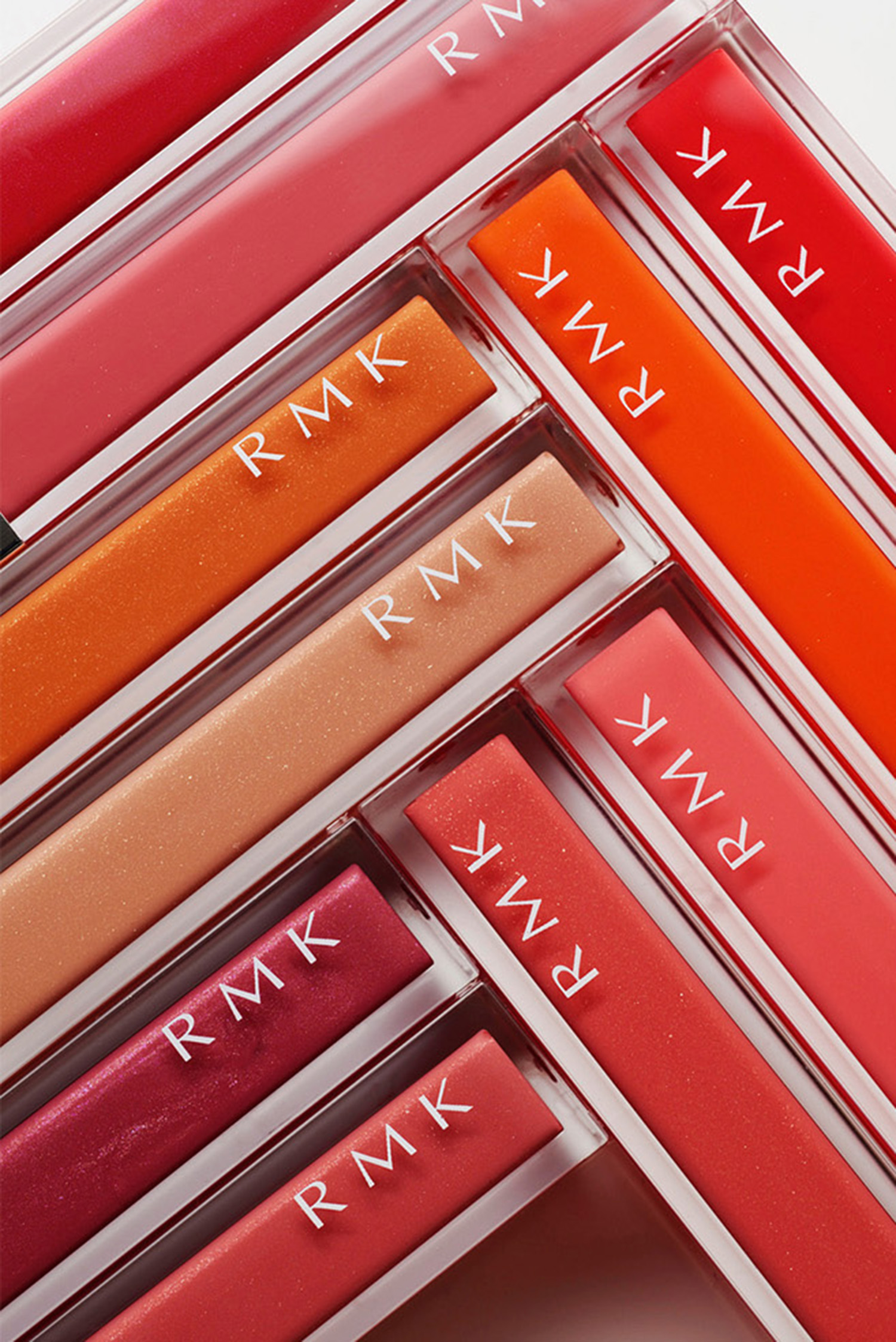 KMA stylist Sara Wacksman designs set for photo of many colorful tubes of lipgloss arranged in lines for RMK 