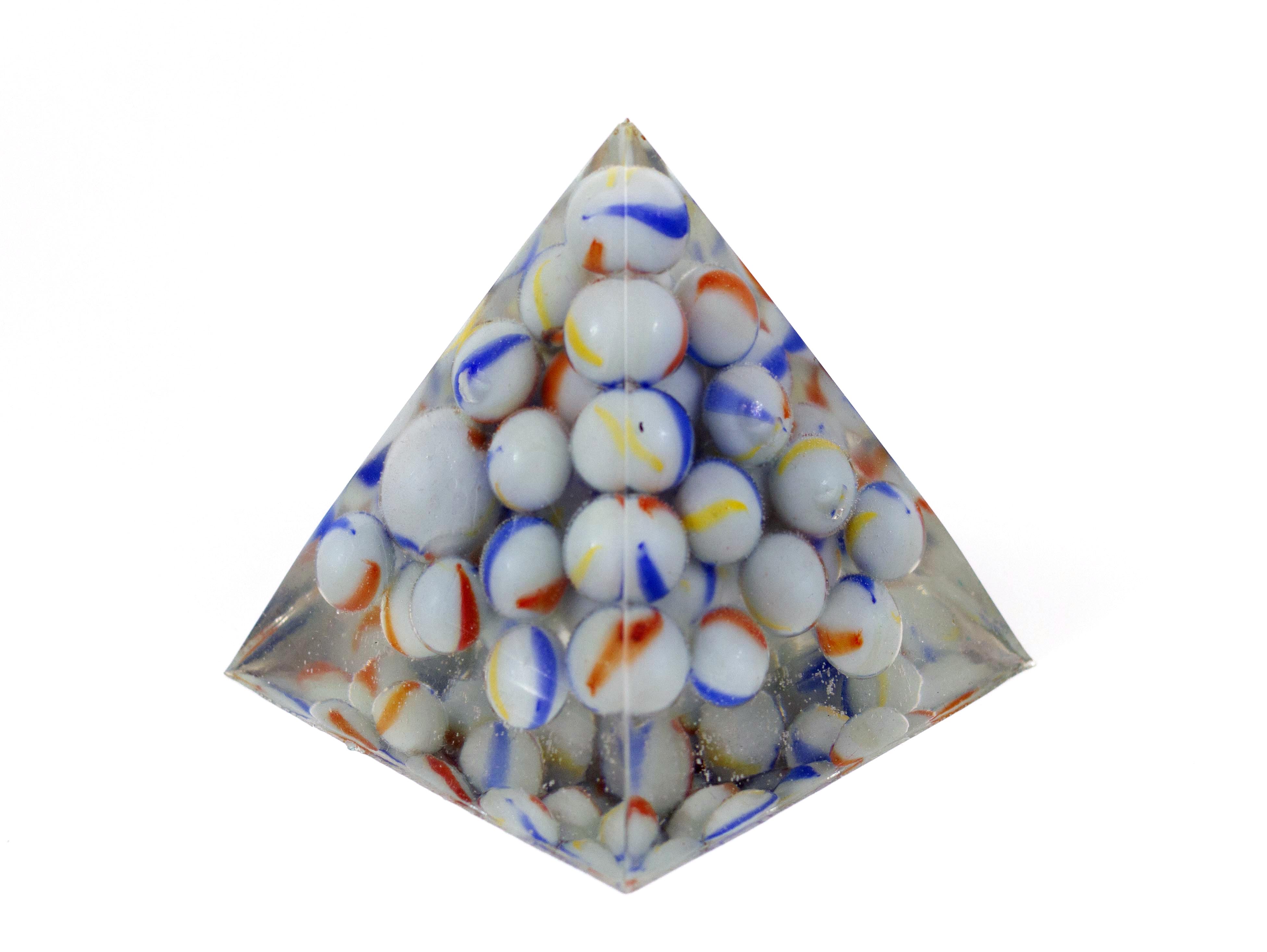 A Big Mouthful of Marbles, 2019, 4"x4"x4". Glass marbles, epoxy resin