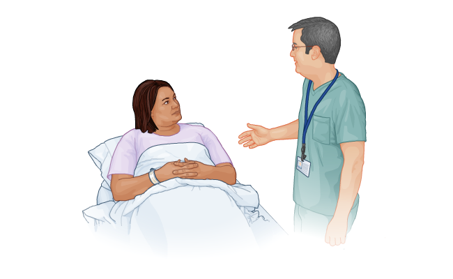 Patient listening to nurse (1 of 2)