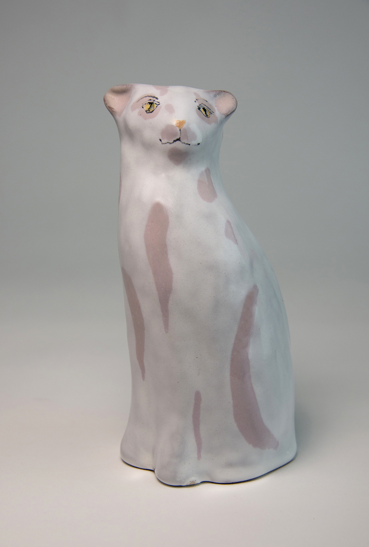 Cat with exotic bird landing. height 15cms £250