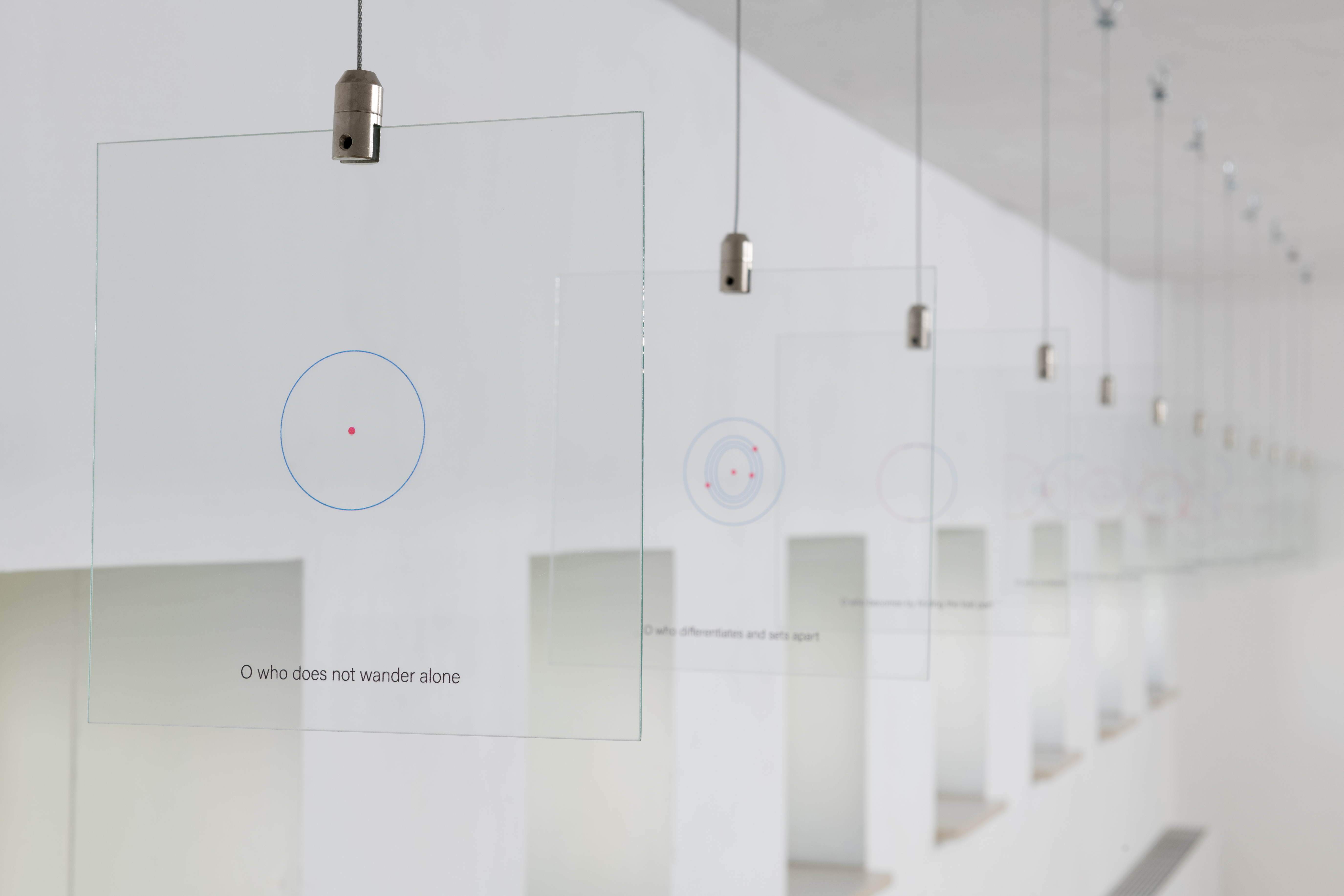 Merey Şenocak, A Picture of O, 2022. Uv printed glass, iron wire, 12 pieces of glass, each 20x20 cm. Photo: LNDWstudio