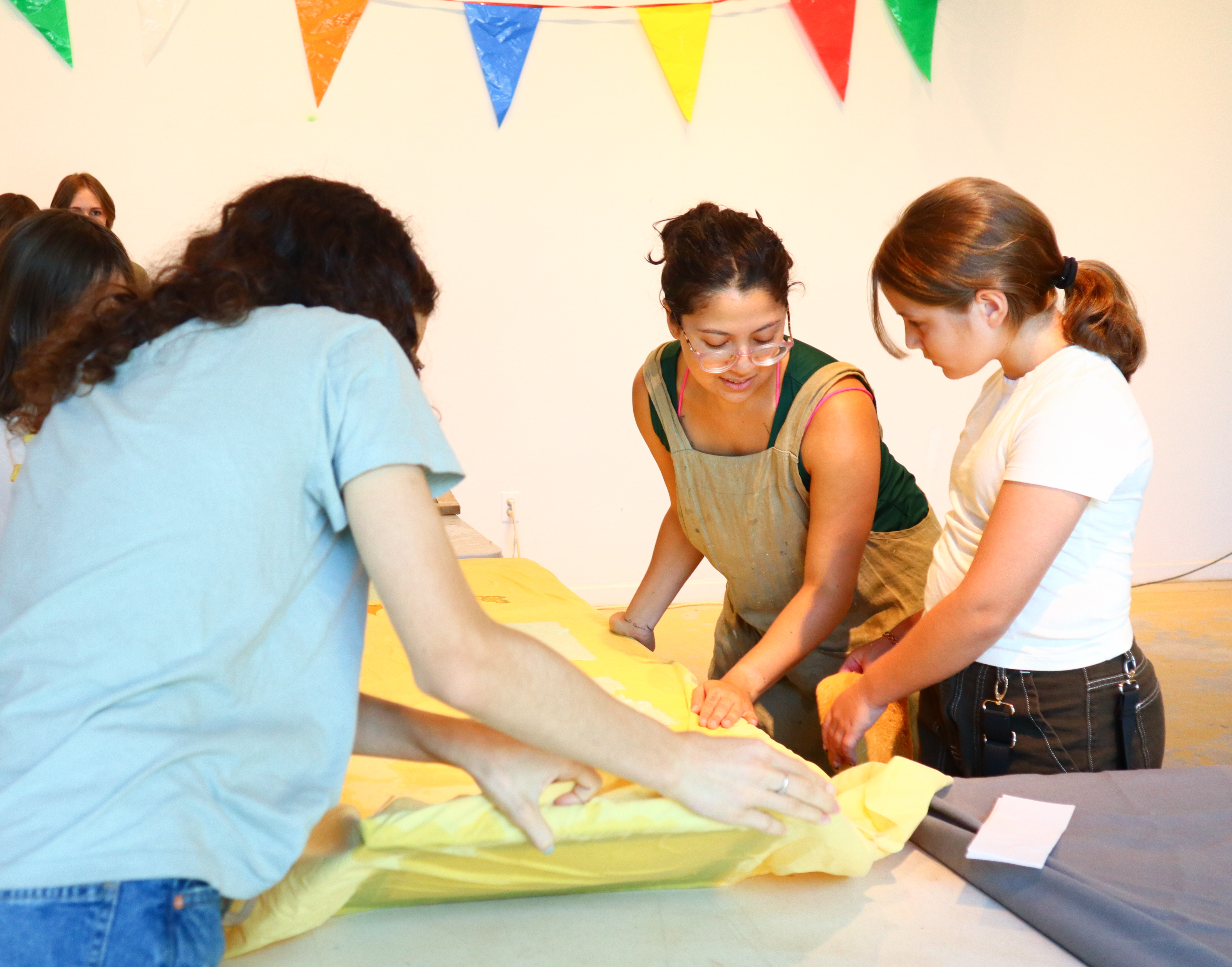 instructing kids on paper making techniques