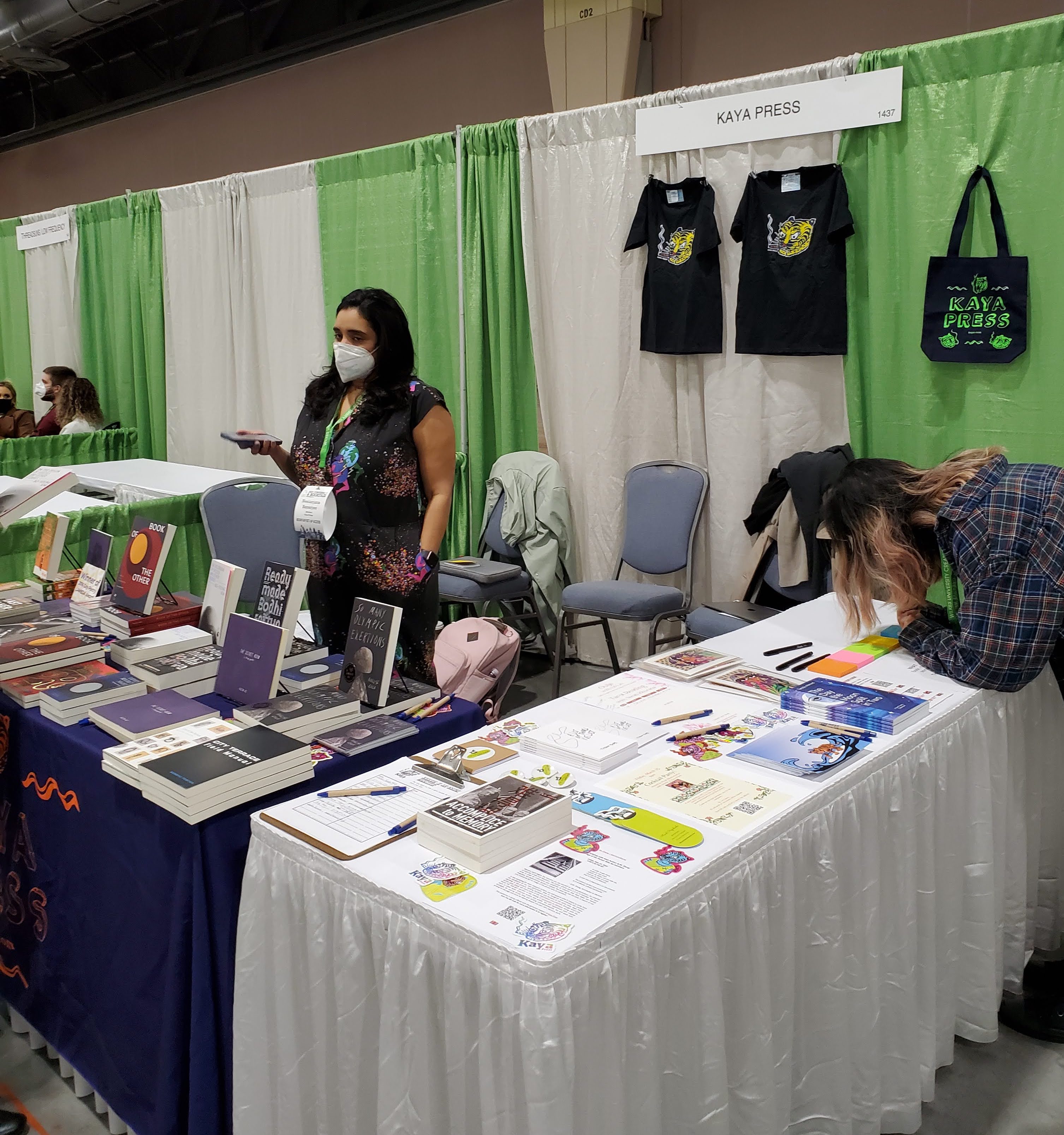Neela Banerjee at Kaya Press booth. AWP Philadelphia, Pennsylvania. March 2022. Photo by Jhani Randhawa.