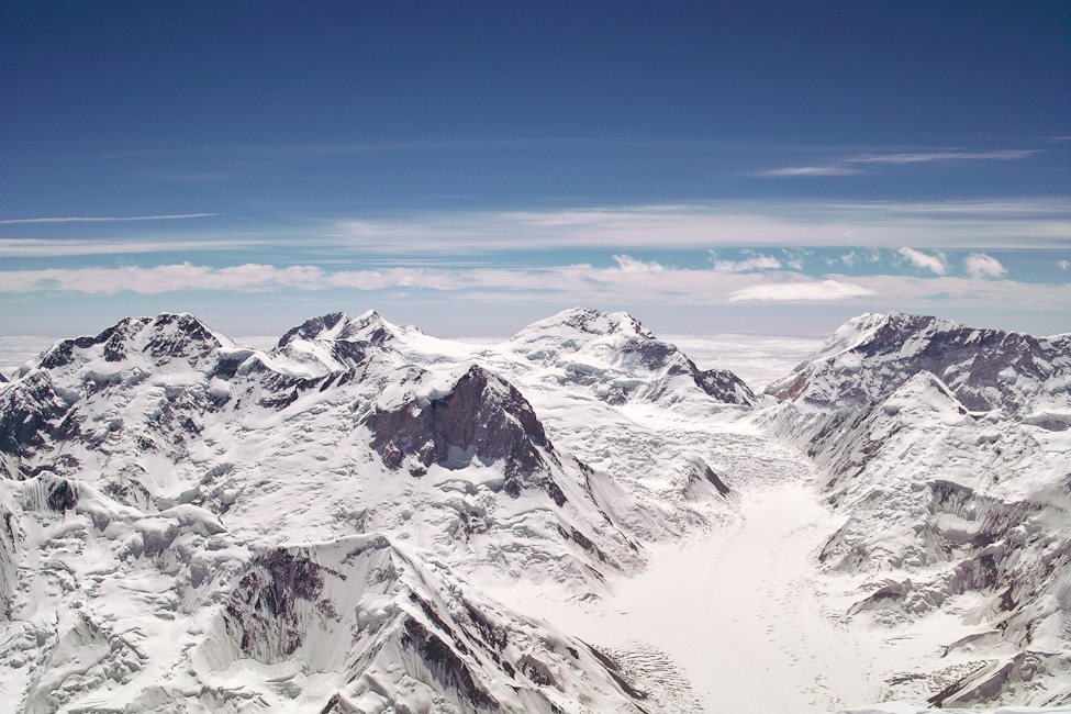 View over the Tien Shan from the summit of Khan Tengri. Pik Pobeda East in the far back, right. The NE ridge forms the left skyline