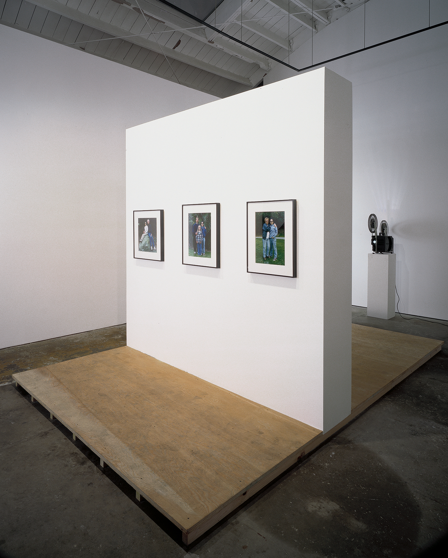 Untitled Sculpture, 1999. Seven photographs, one 16mm film, projector, wood and plasterboard exhibition structure. Dimensions variable