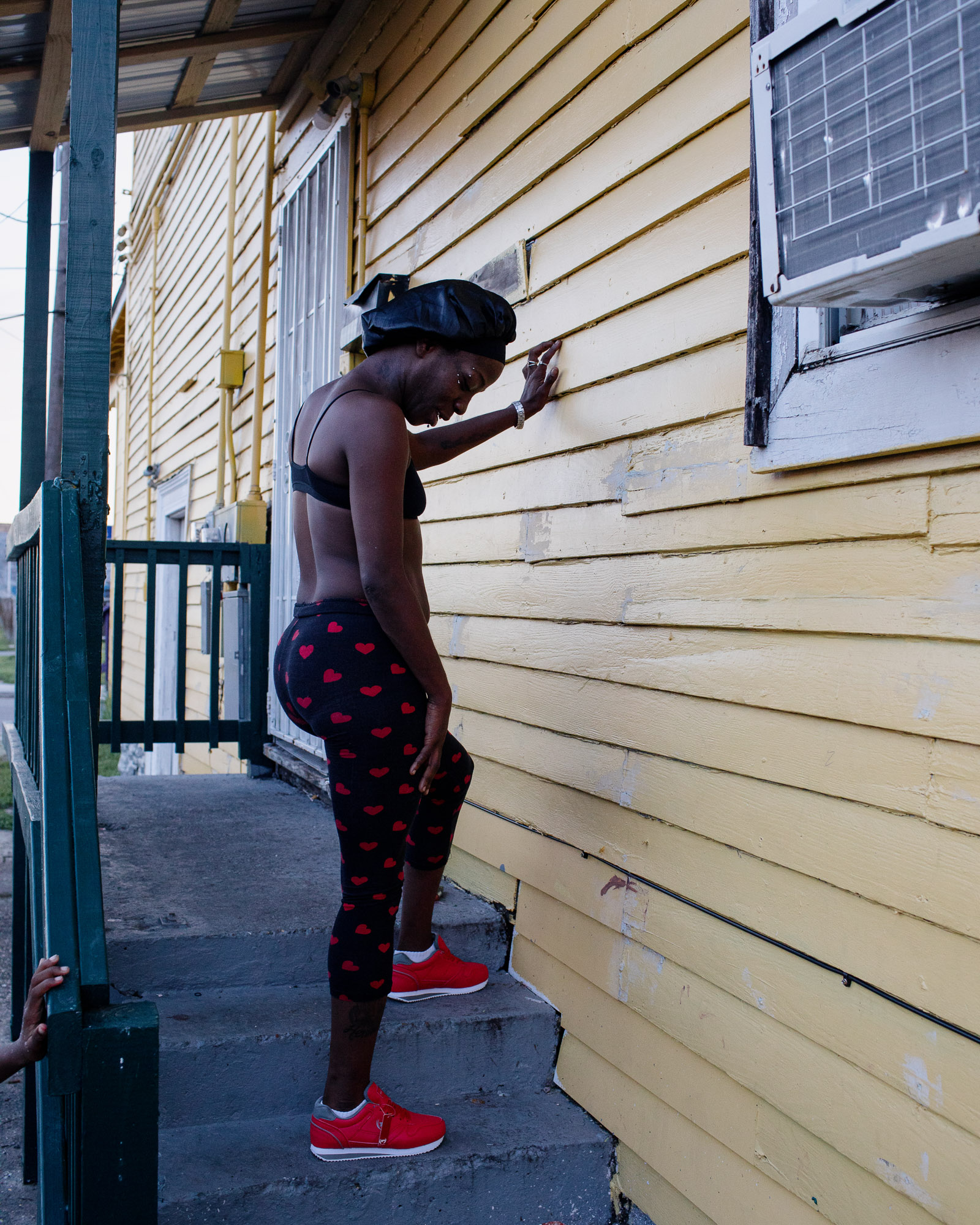 A woman at her home in the Holy Cross neighborhood.
