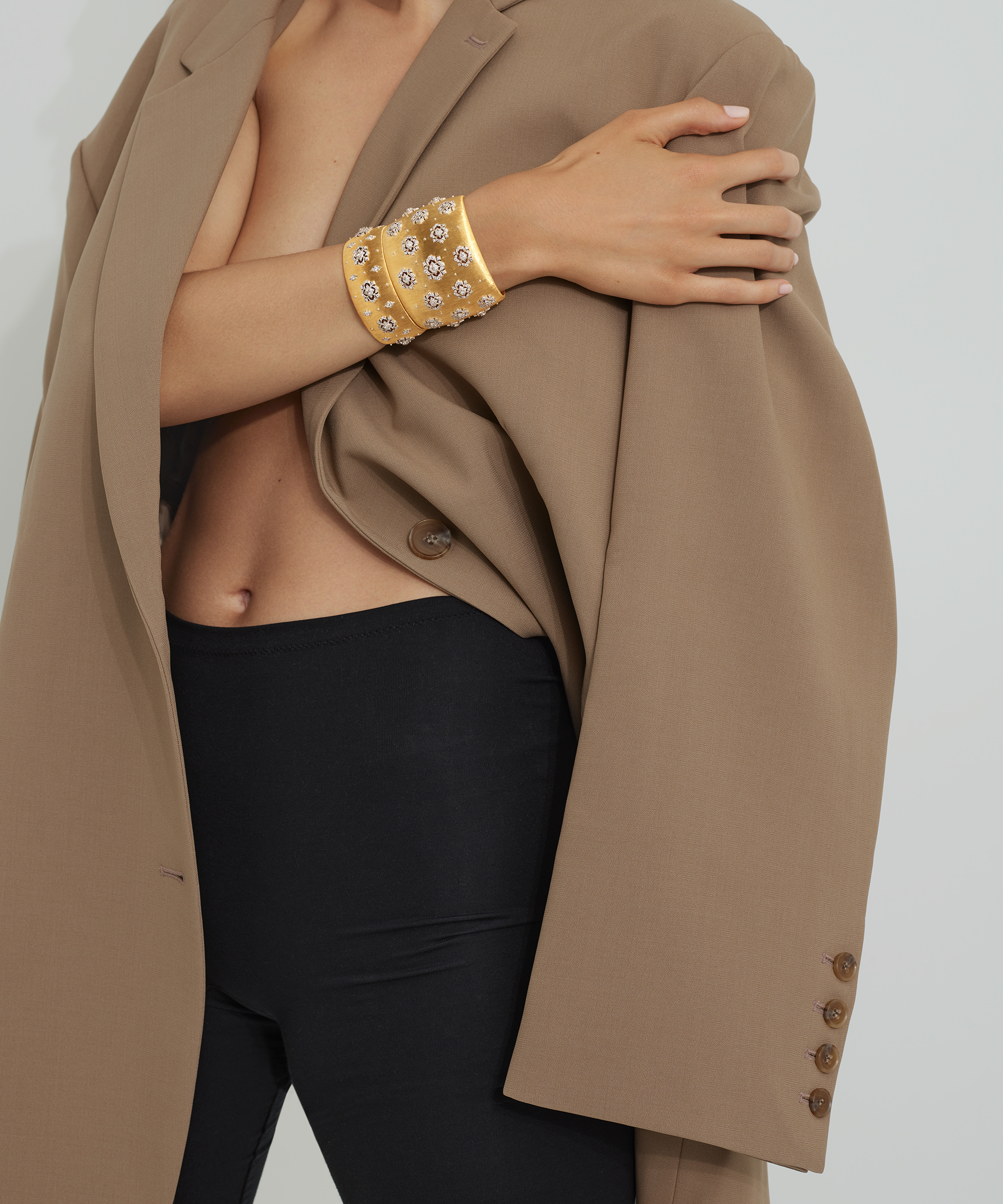 KMA photographer Isabelle Bonjean shoots a female model wearing holg bracelet for L'Officiel Magazine