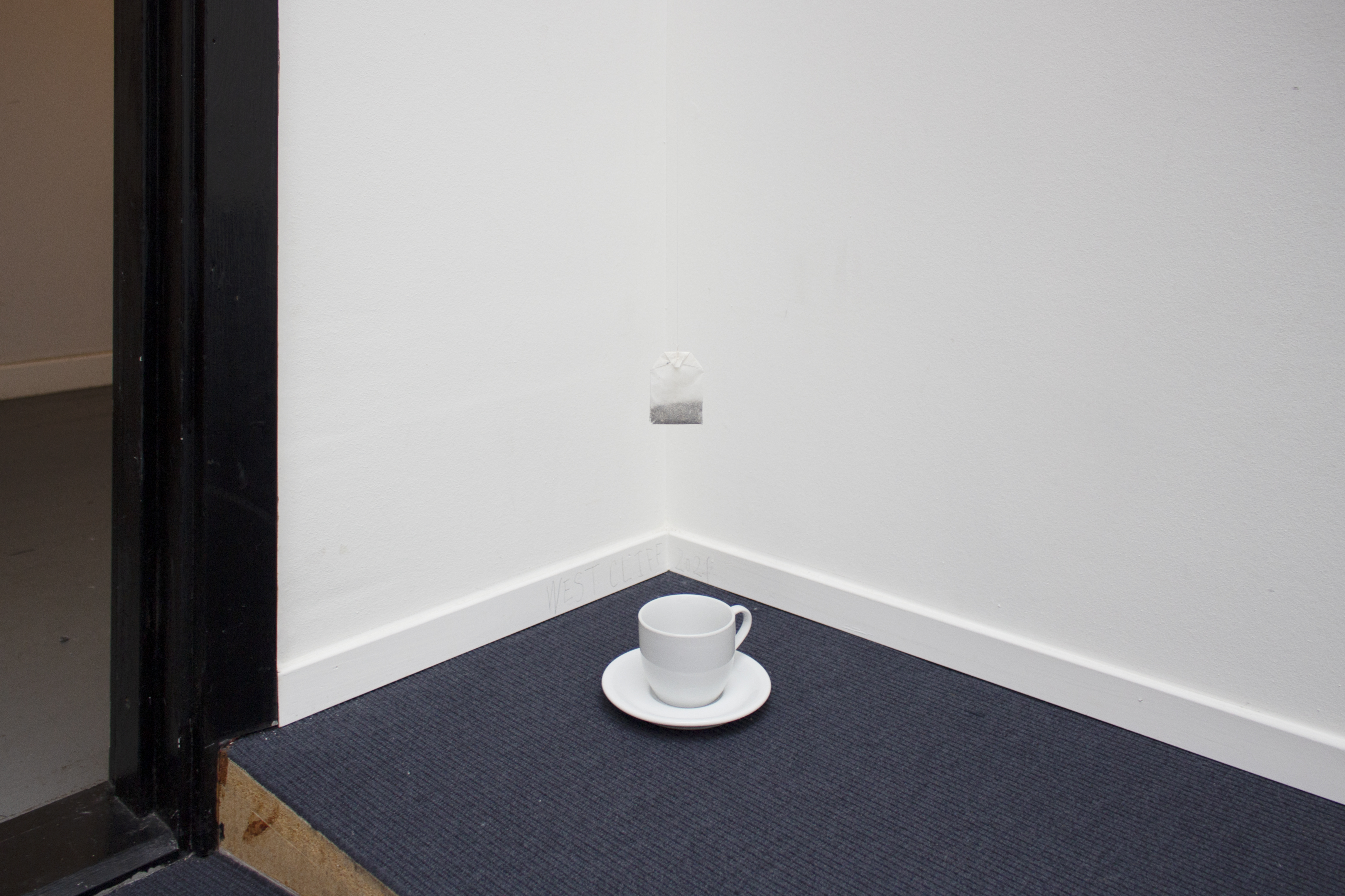 "WEST CLIFF", 2021, film with sound, 5 min loop, teabag, thread, cup and saucer, installation dimensions variable
