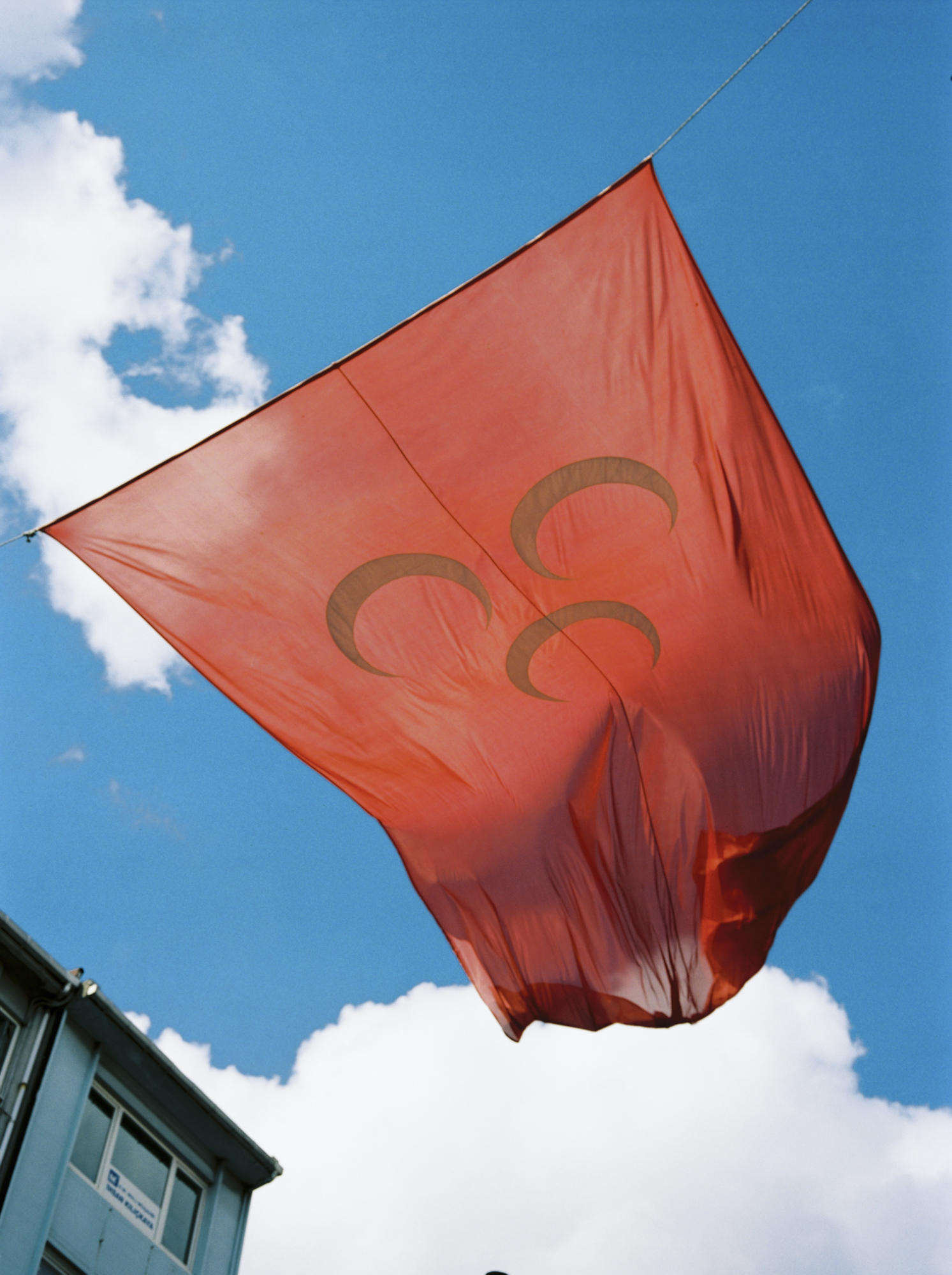 On Söğütlüçeşme street in Kadiköy are the headquarters of the MHP, an openly racist and ultra nationalist party. Their flag measuring several meters is hanged over the street.