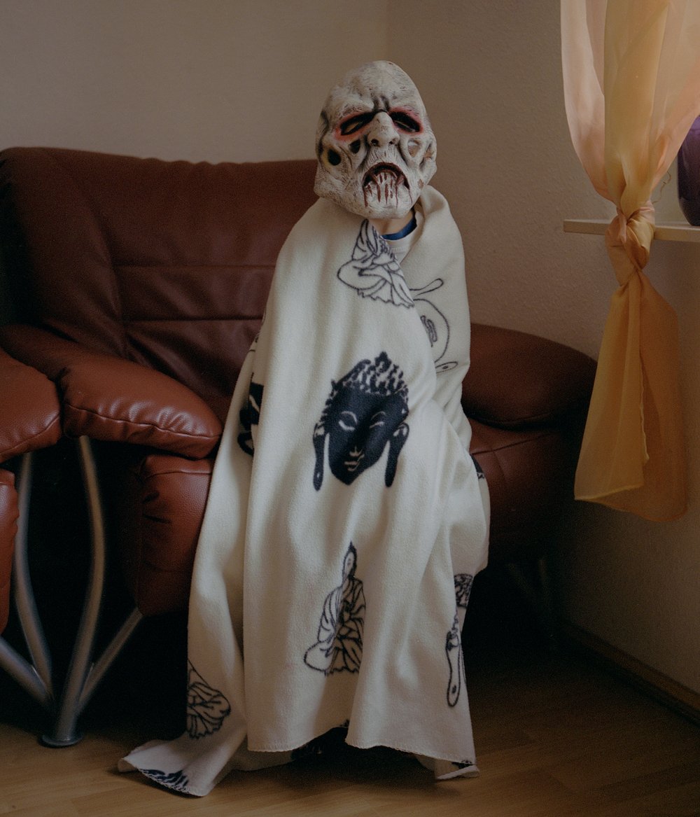 Germany, January 12, 2020: Saber, six, dressing up in his room.