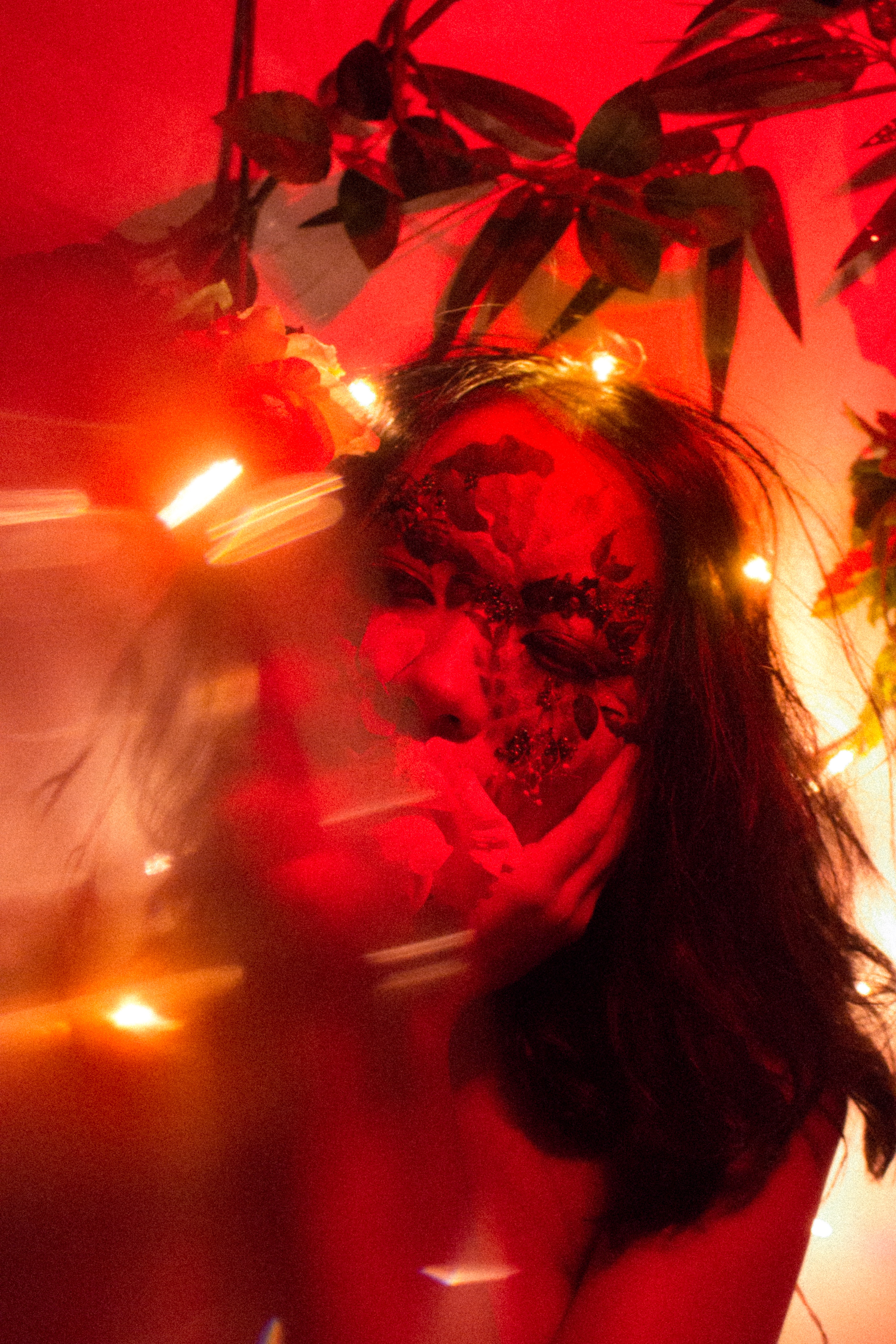 red camellias bloom, your eyes averted. the prism flashes gently under quiet light.  [imperfect]