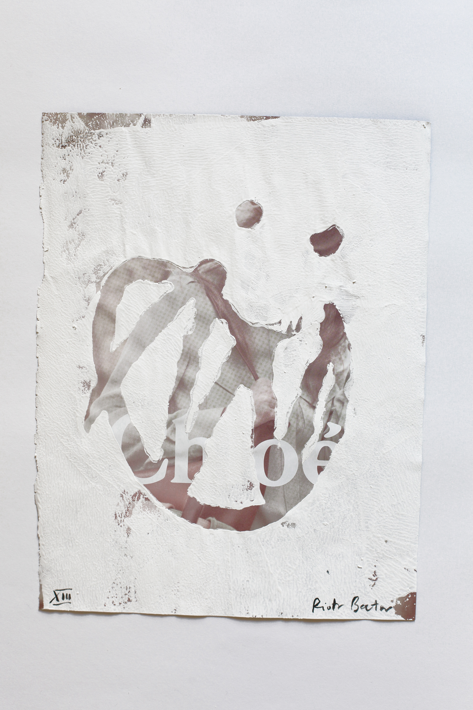 "No. 13" from "making faces" series. Approx. 28.5 x 22 cm / 11.2 x 8.6 inches. White household paint on magazine page