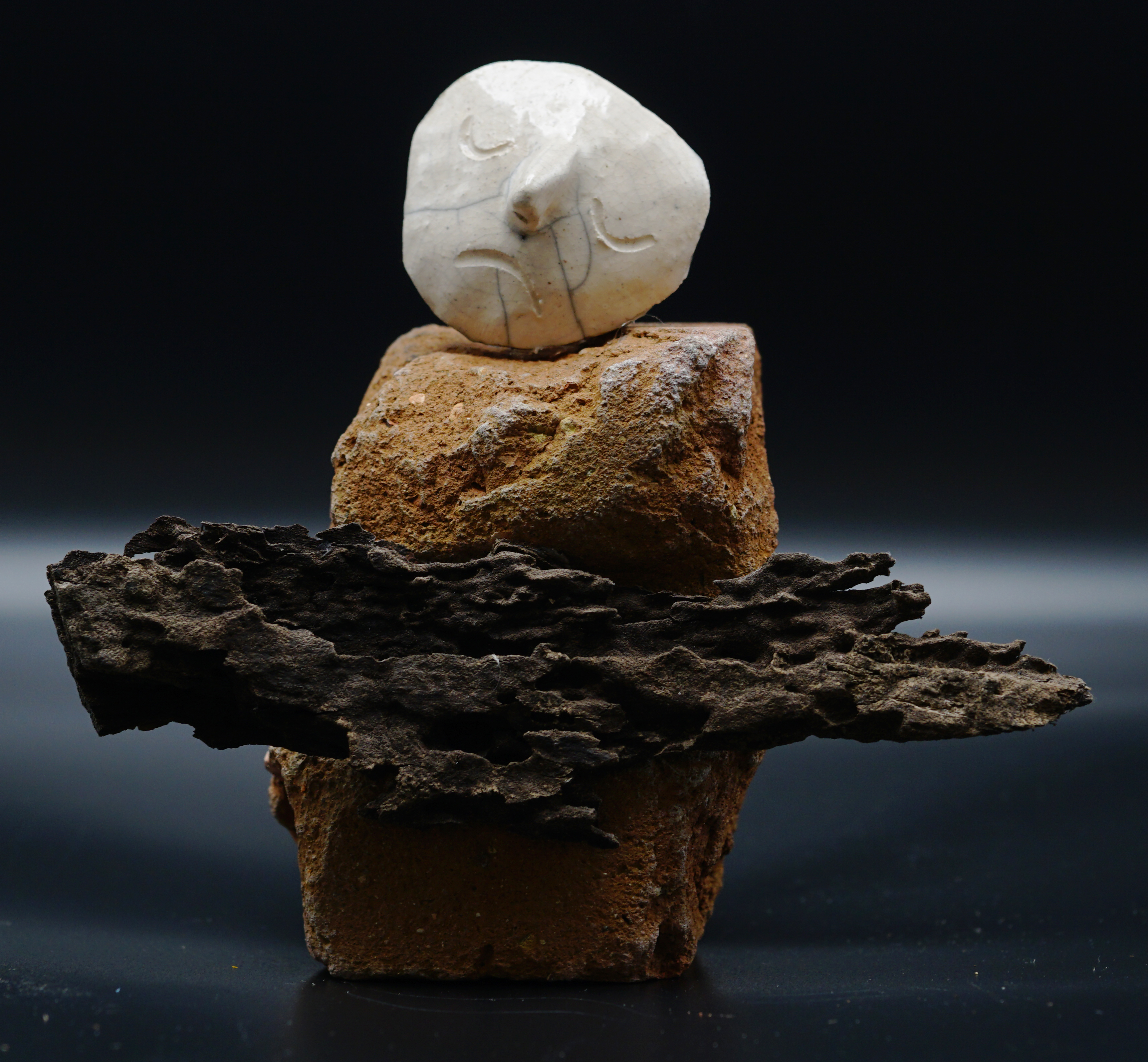 "Holding on to Something Hollow," raku-fired ceramic with found brick and wood