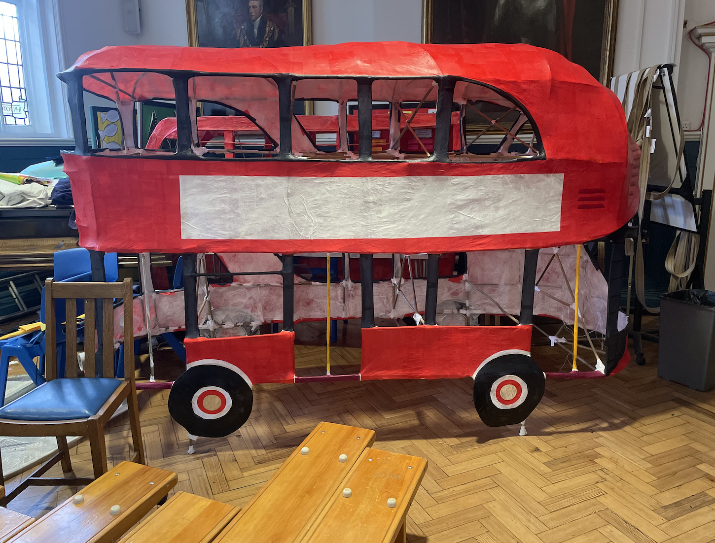 In 2024, I worked with Key Stage 2 students at Aldgate Primary School on the theme of 'magical modes of transport.' Together, we crafted woven wicker frames and vibrant tissue paper sculptures, exploring connections between sculpture and performance art along the way.