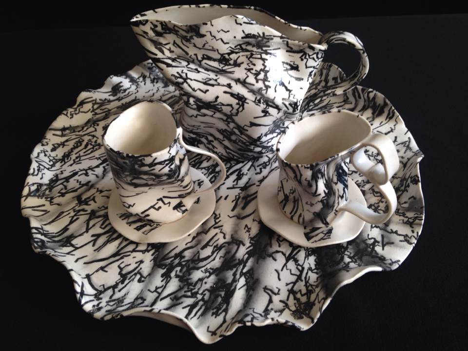 The Looking Glass Collection Napkins and placemat fabrics, made for a New Museum edition, function as “trackables” for The Looking-Glass App, a custom augmented-reality application for phone or tablet. When viewed through the app, one can see strobing animations of Lewis Carroll's Alice embedded in the patterns. These augmented linens are part of The Looking Glass Collection, including: artisanal porcelain plates in a service for 12, and hand-thrown paper-porcelain platters, “magic mirrors” loaded with the Looking-Glass custom software, and miniaturized tea sets.