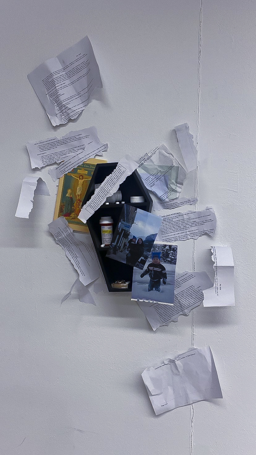 This piece is a memorial to my childhood and innocence regarding my mental illnesses using an archive of medical records, medication, childhood photos, family heirlooms, and a shelf that I used to organize my medication when it was first prescribed to treat my mental illnesses in high school. I decided to make the interventions of shredding the medical records to both highlight certain aspects of past treatments such as religion and hide other aspects that I don't like to talk about as much. I wanted the overall effect to feel very scattered and frantic to represent the actual process of diagnosis and treatment.