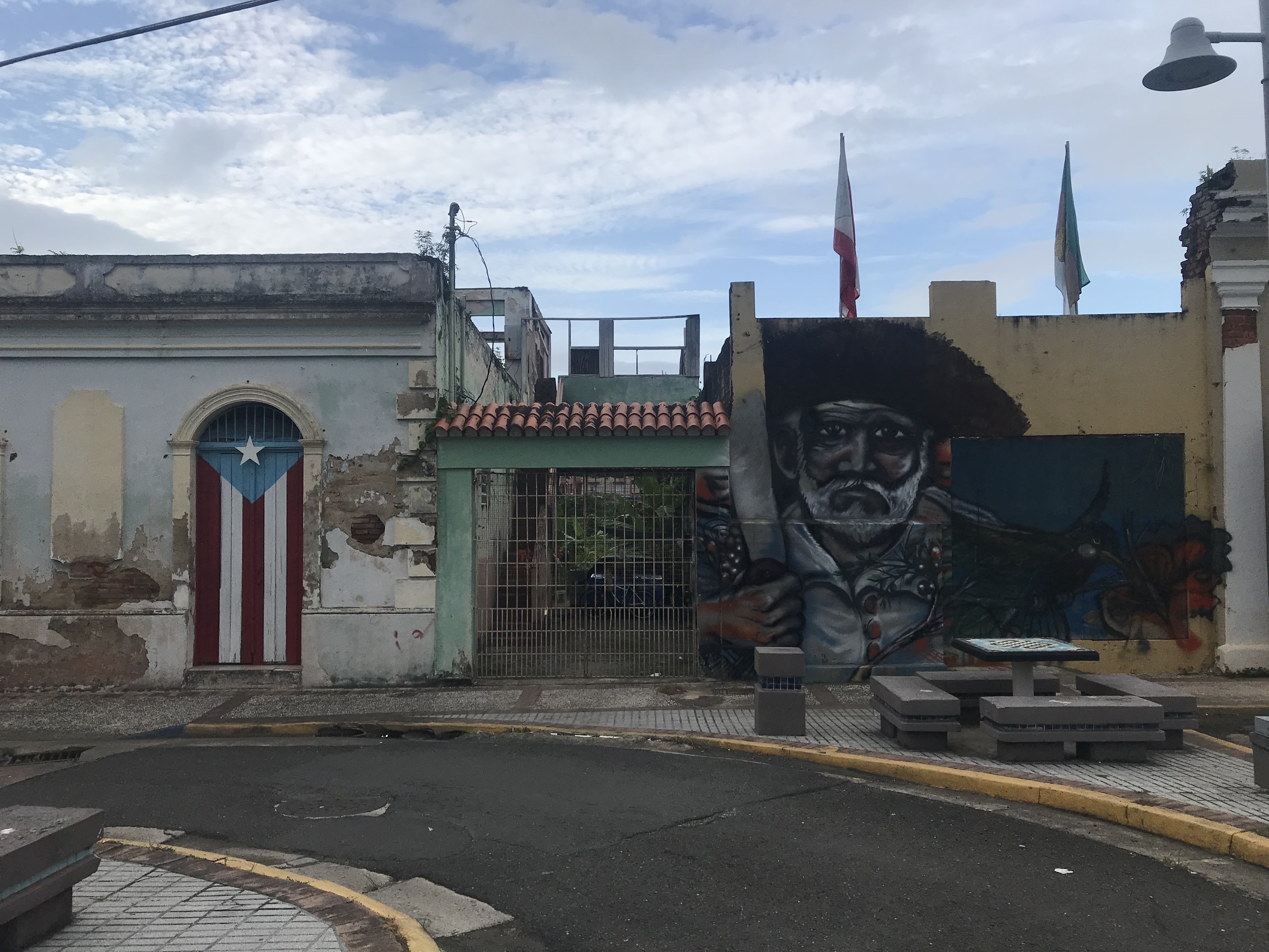 Murals representing Puerto Rican identities: the Puerto Rican Flag and the Jibaro, a self-subsistence farmer, Utuado.