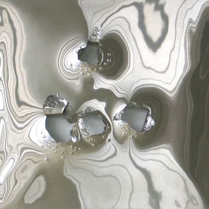 Los Lunas #20, 2005, stainless steel with gunshot, 24x24 in