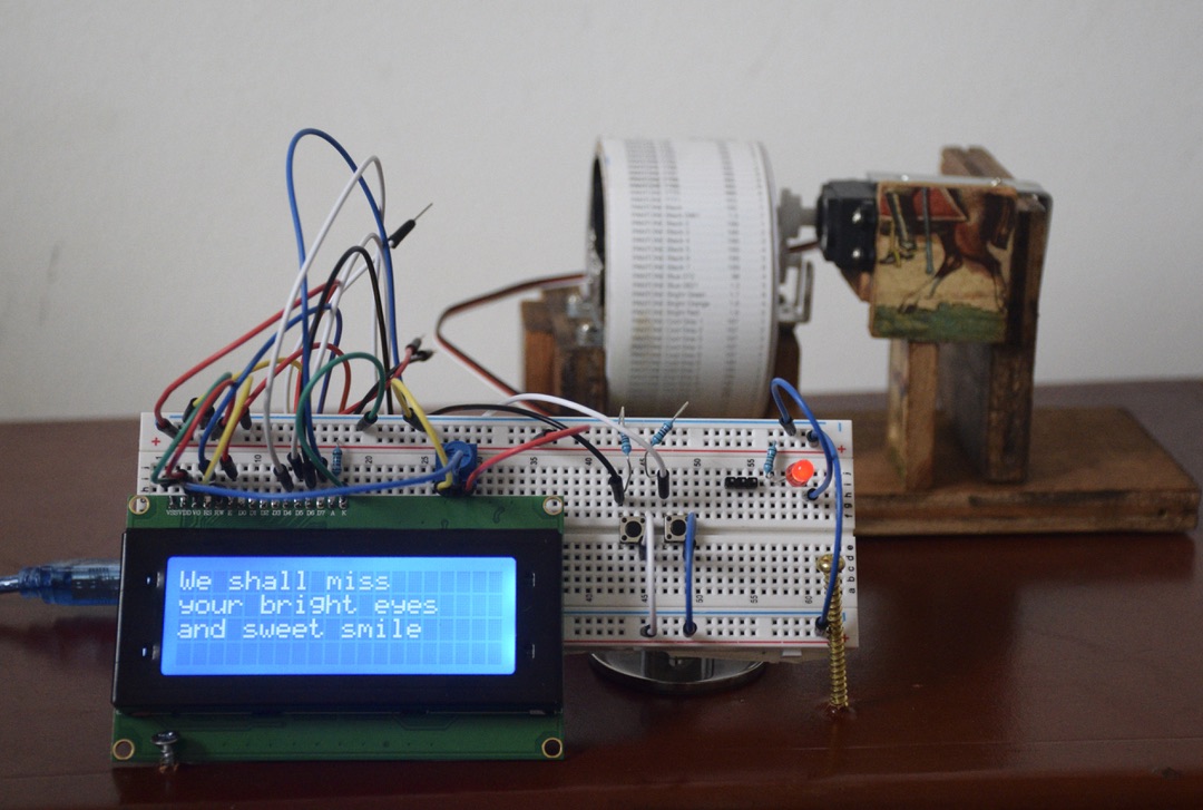 Red River Valley (Folk Song Machine I) 2024 Wood, aluminum, music box, Arduino Uno, servo motors, Pantone color index, breadboard, LCD display screen, LED